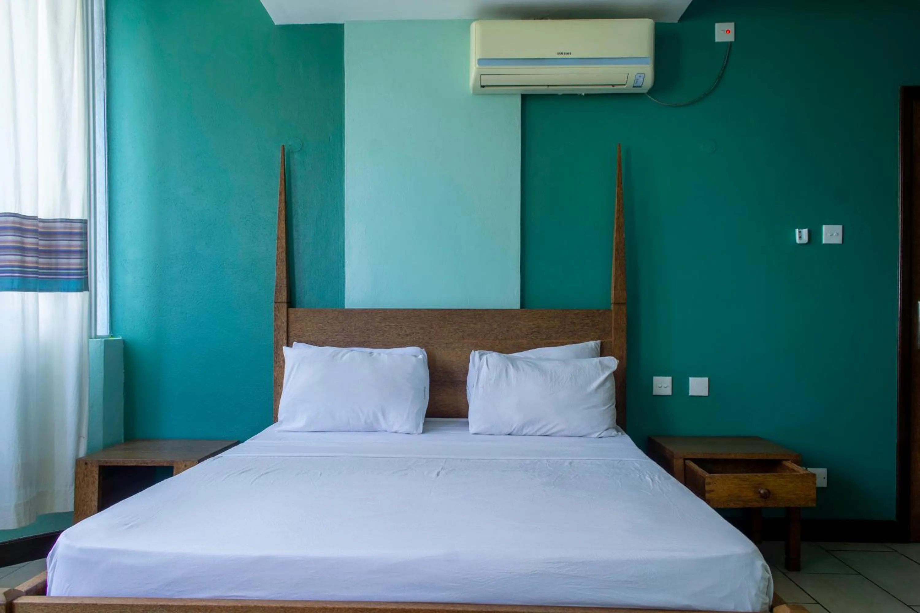 Bedroom, Bed in Cowrie Shell Beach Apartments Official