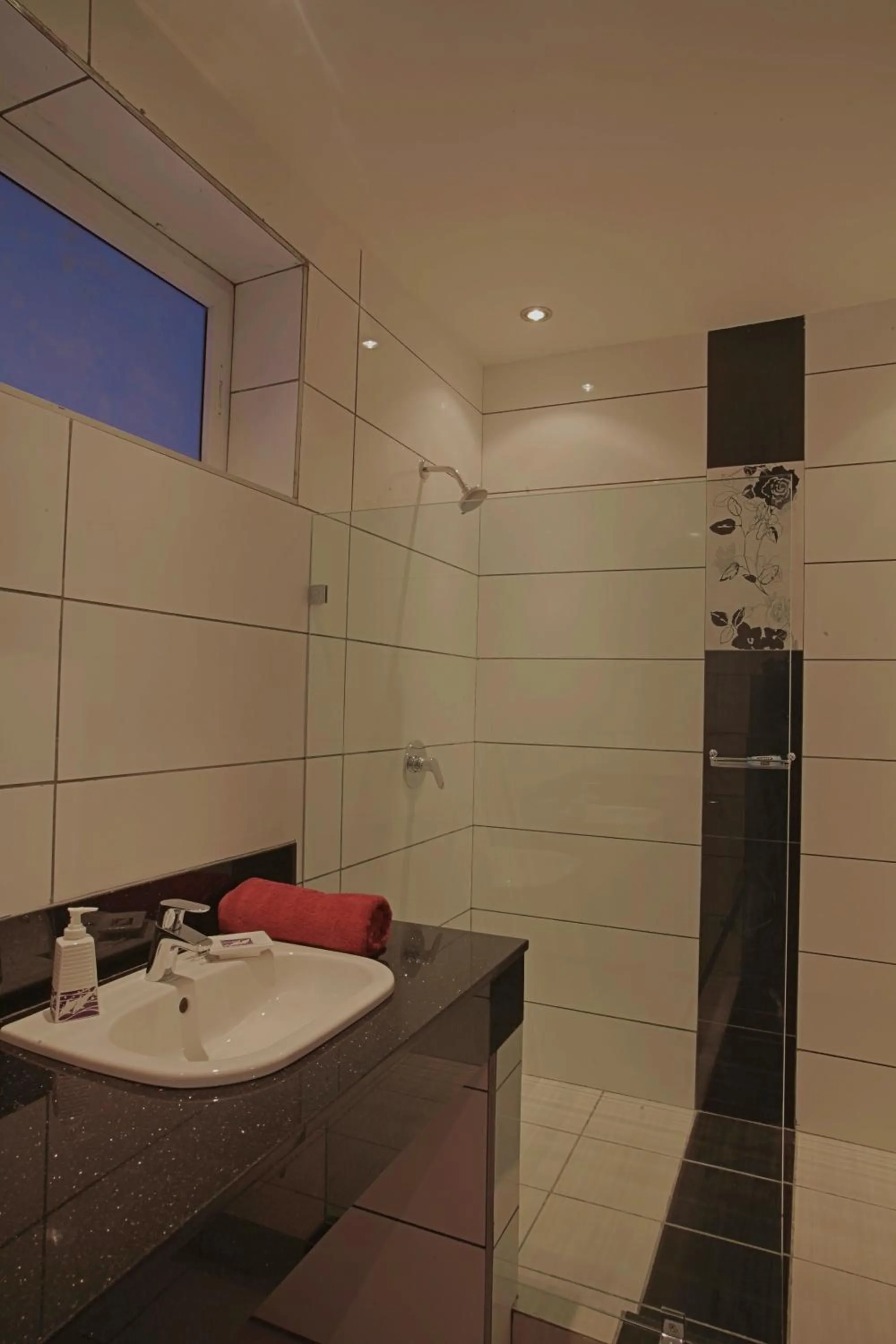 Bathroom in Cowrie Shell Beach Apartments Official