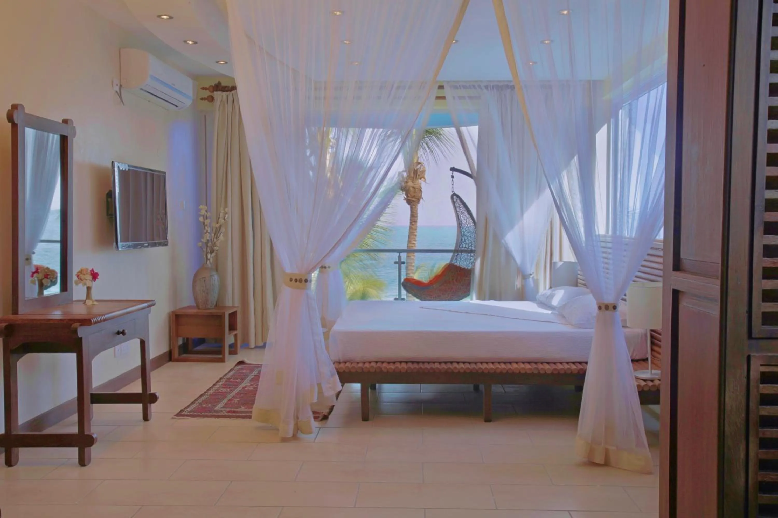 Bedroom, Bed in Cowrie Shell Beach Apartments Official