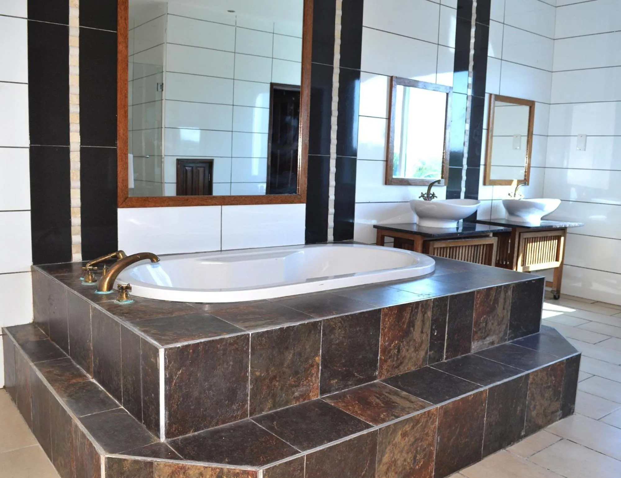 Bathroom in Cowrie Shell Beach Apartments Official