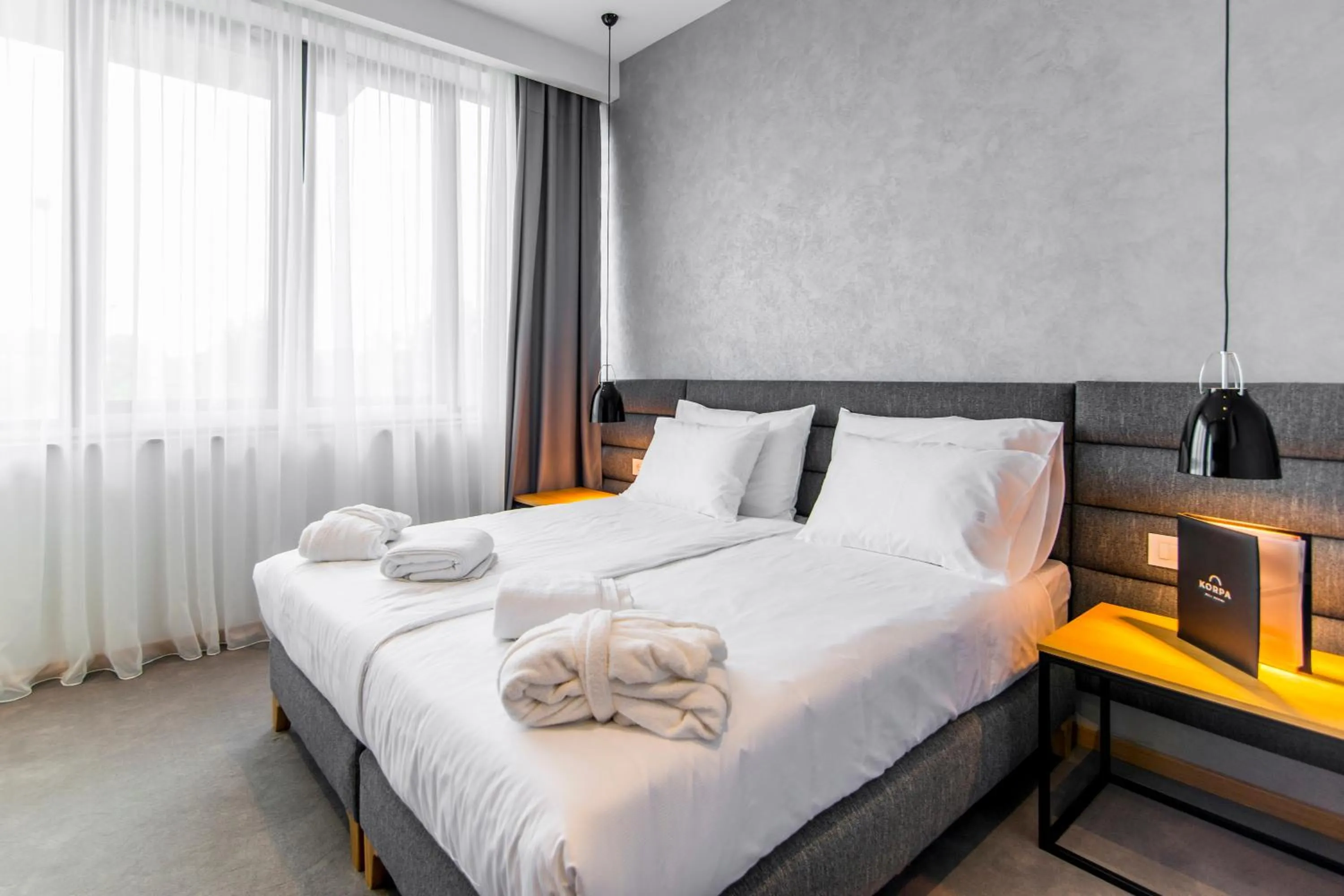 Bed in Korpa Deli Rooms