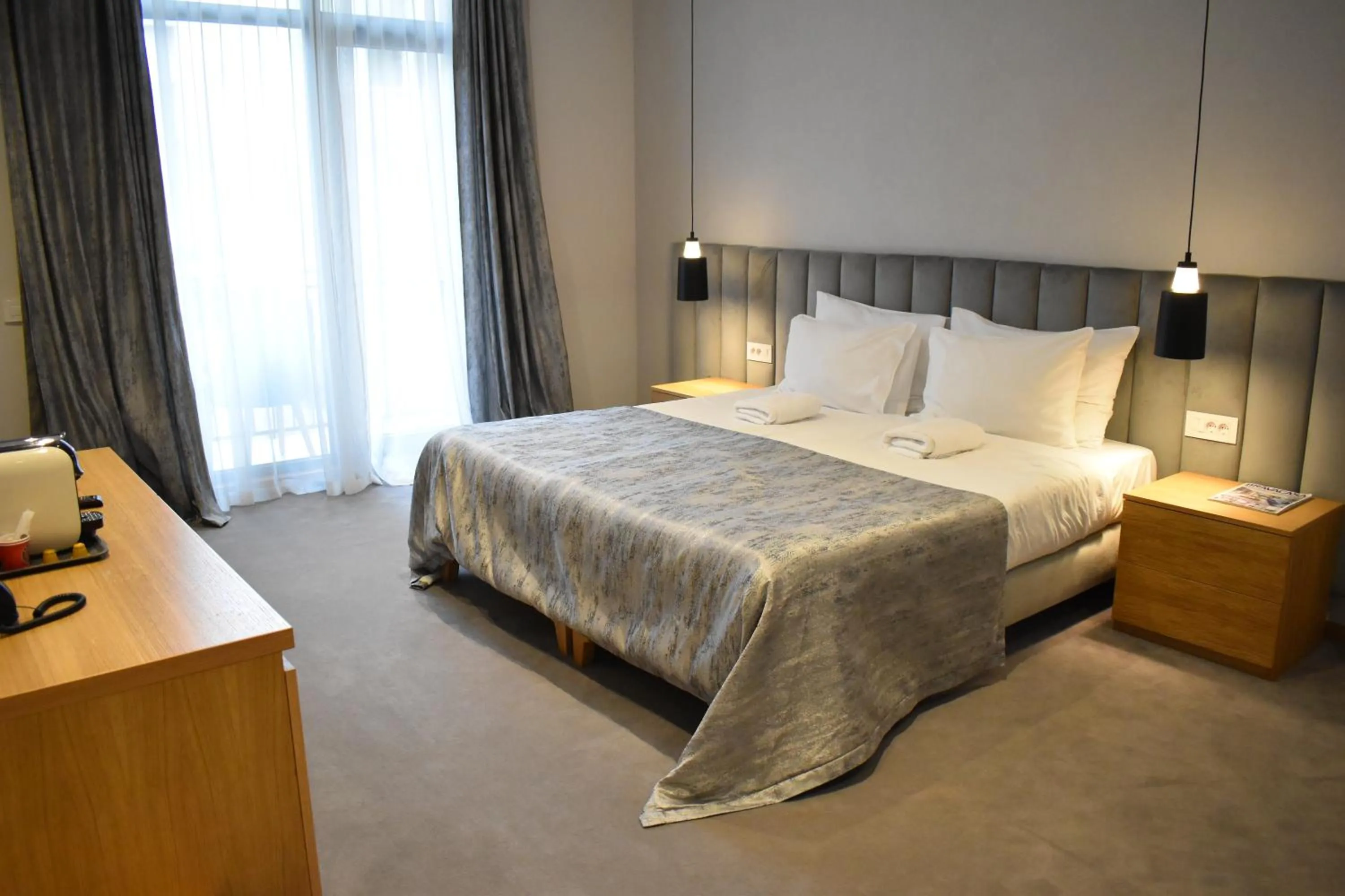 Bed in Korpa Deli Rooms