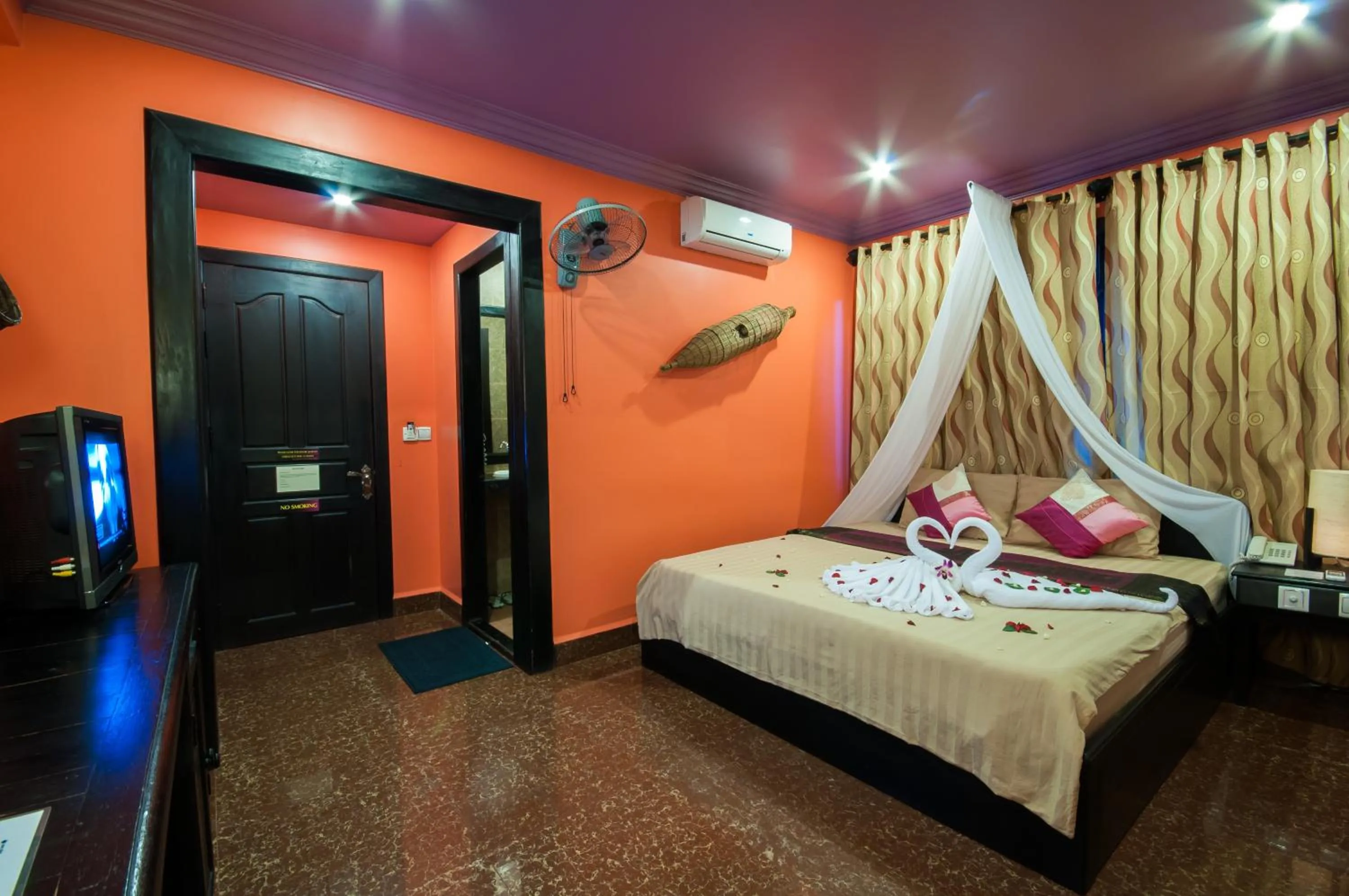 Bed in Golden Butterfly Villa