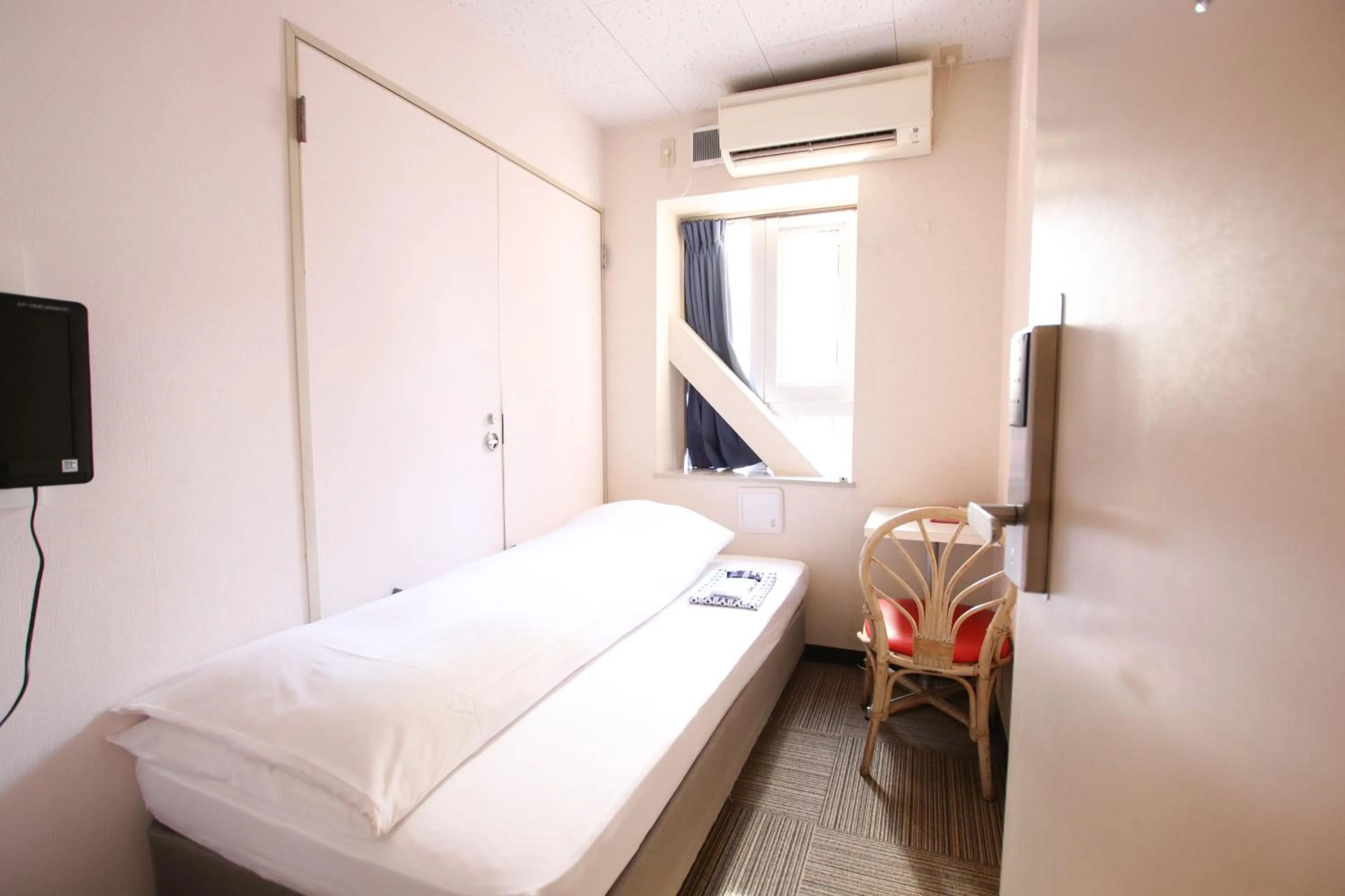 Photo of the whole room, Bed in Sakura Hotel Jimbocho