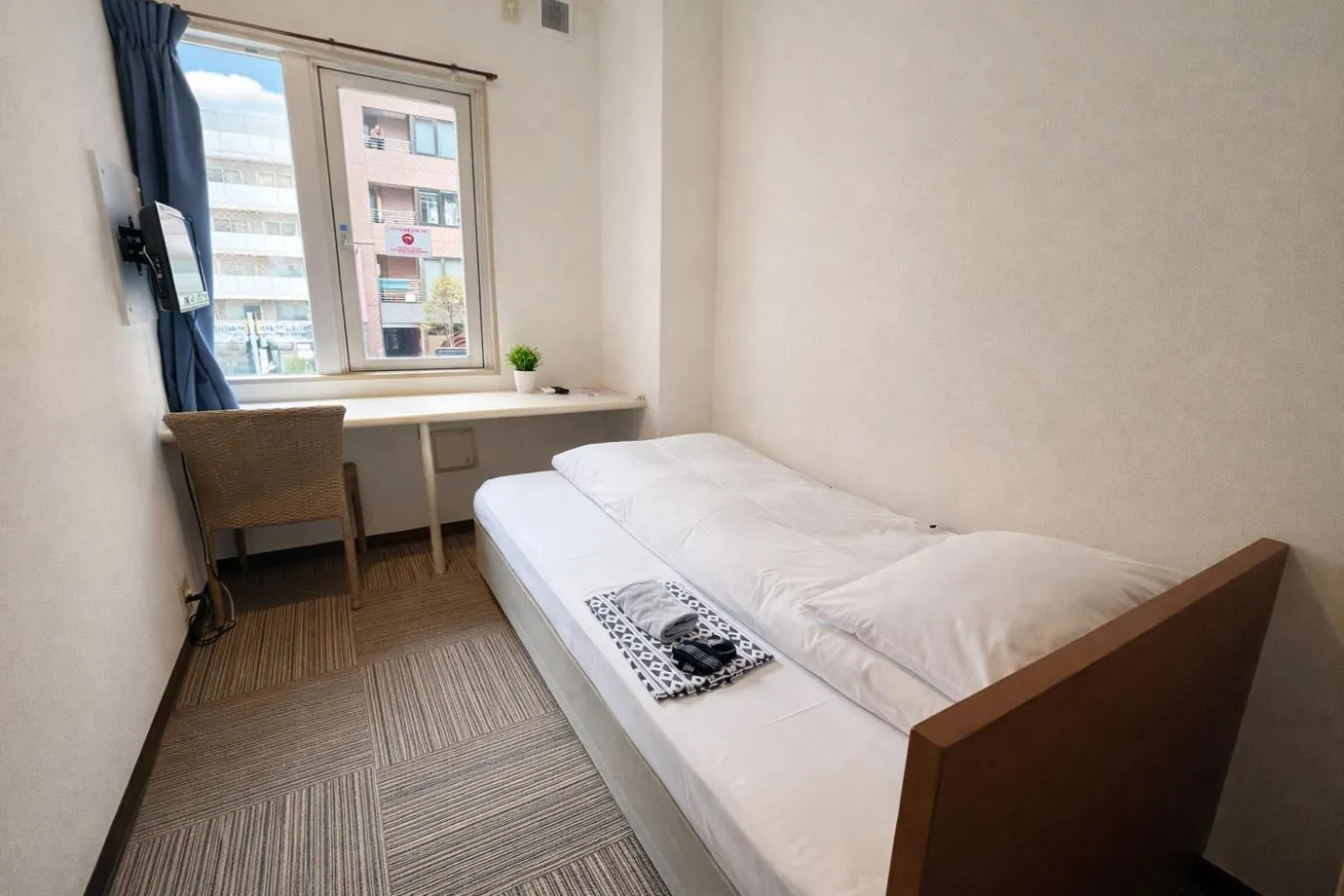 Bed in Sakura Hotel Jimbocho