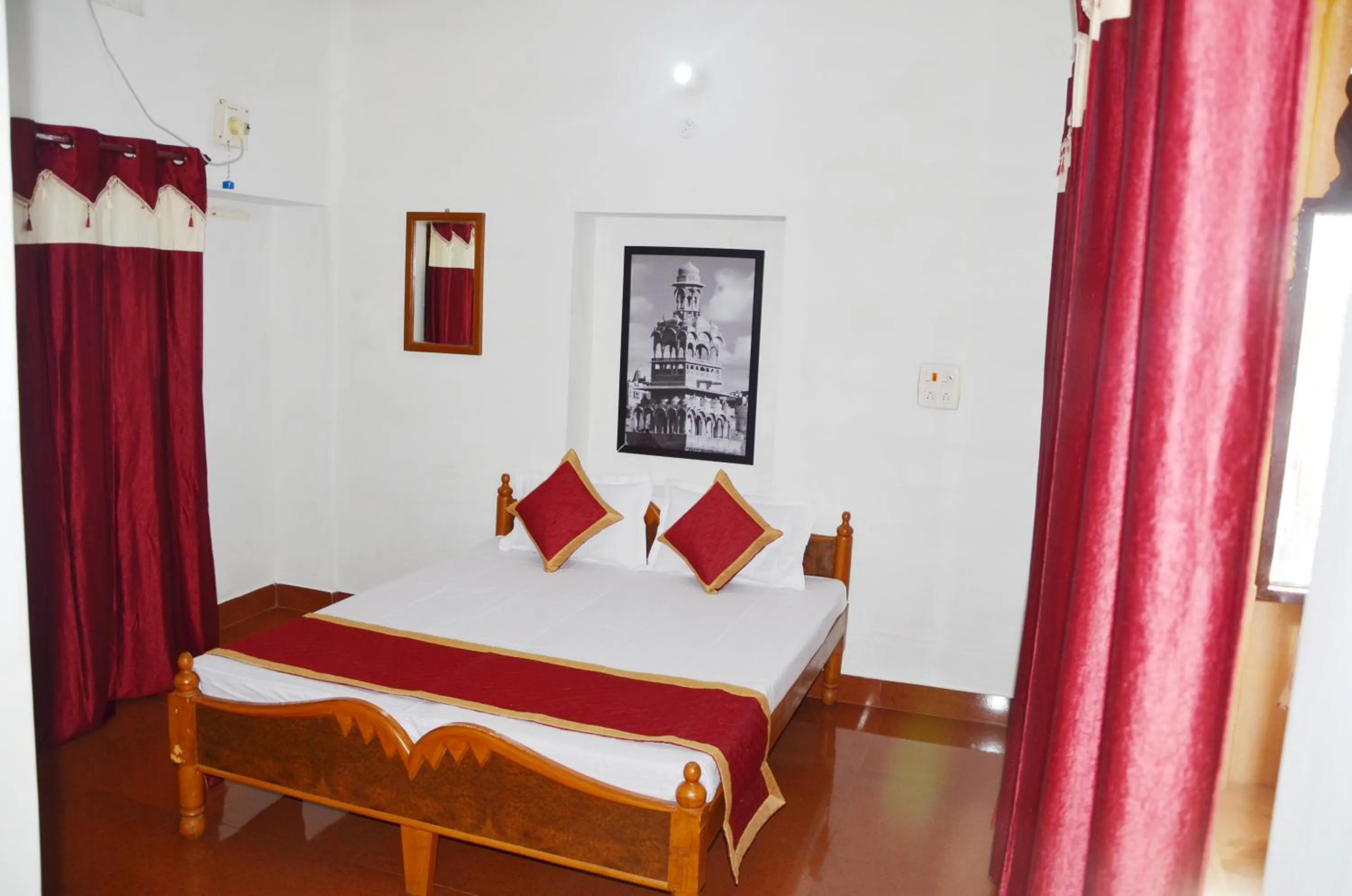 Bed in Gajanand Guest House