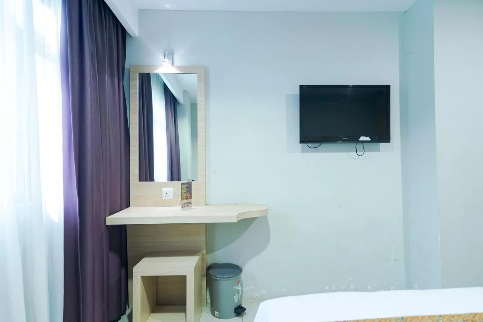 Bedroom, TV/Entertainment Center in The Nagoya Plasa RedPartner