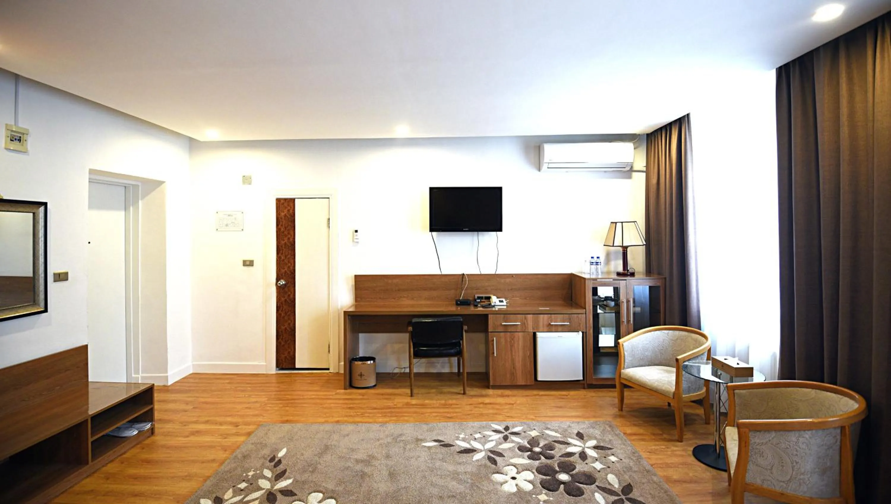 Living room, Bed in Puma Imperial Hotel