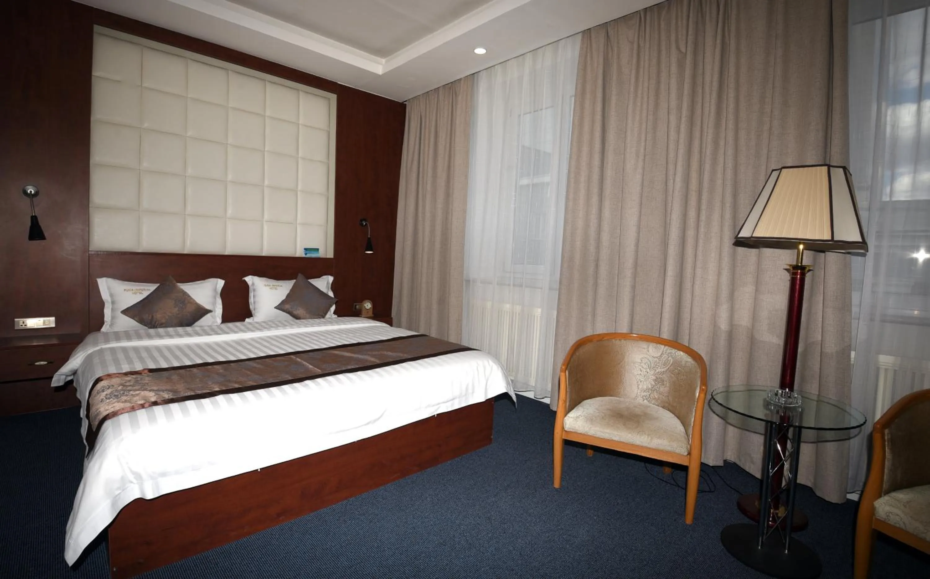 Photo of the whole room, Bed in Puma Imperial Hotel