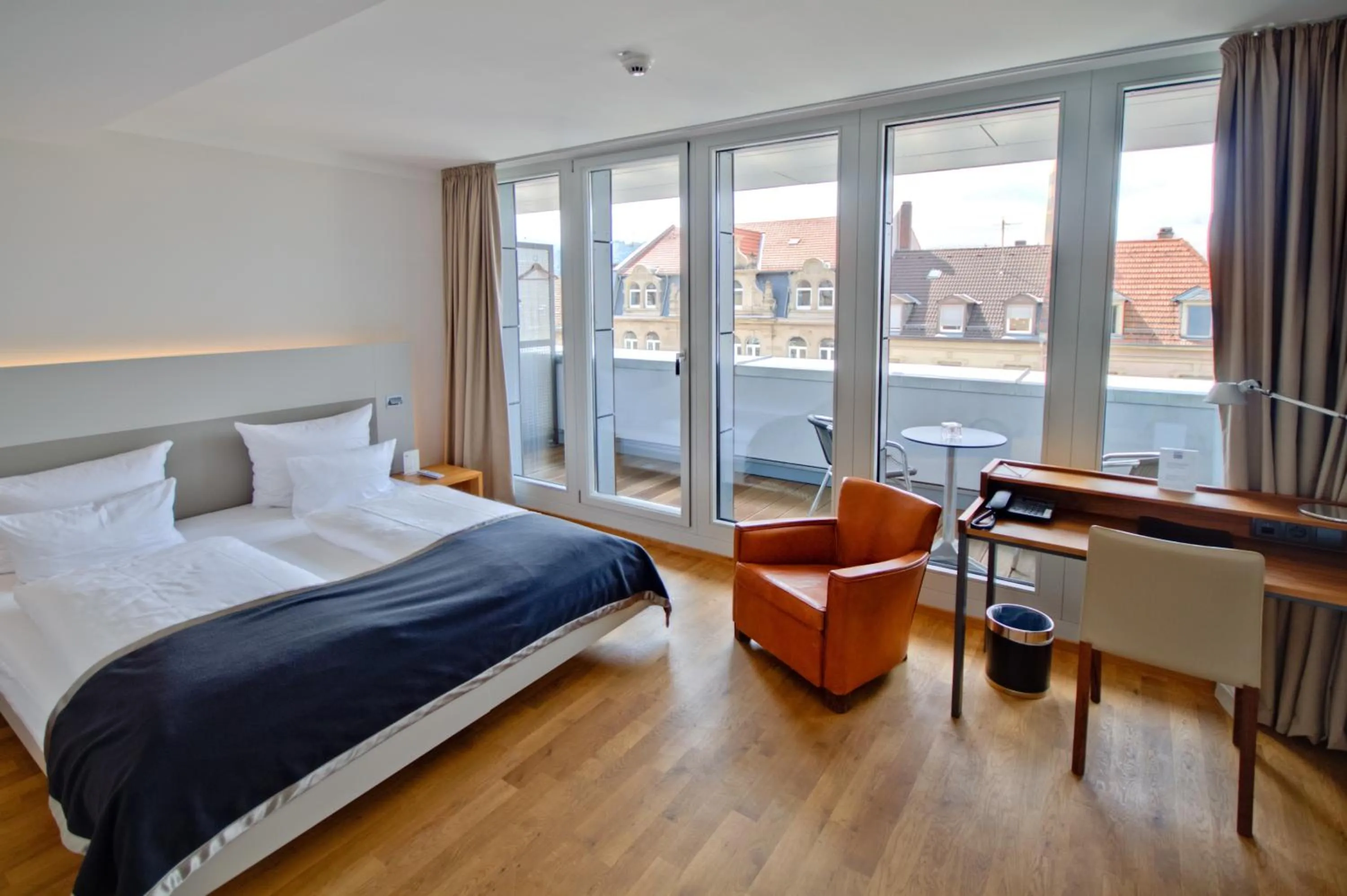 Photo of the whole room, Bed in Qube Hotel Bergheim
