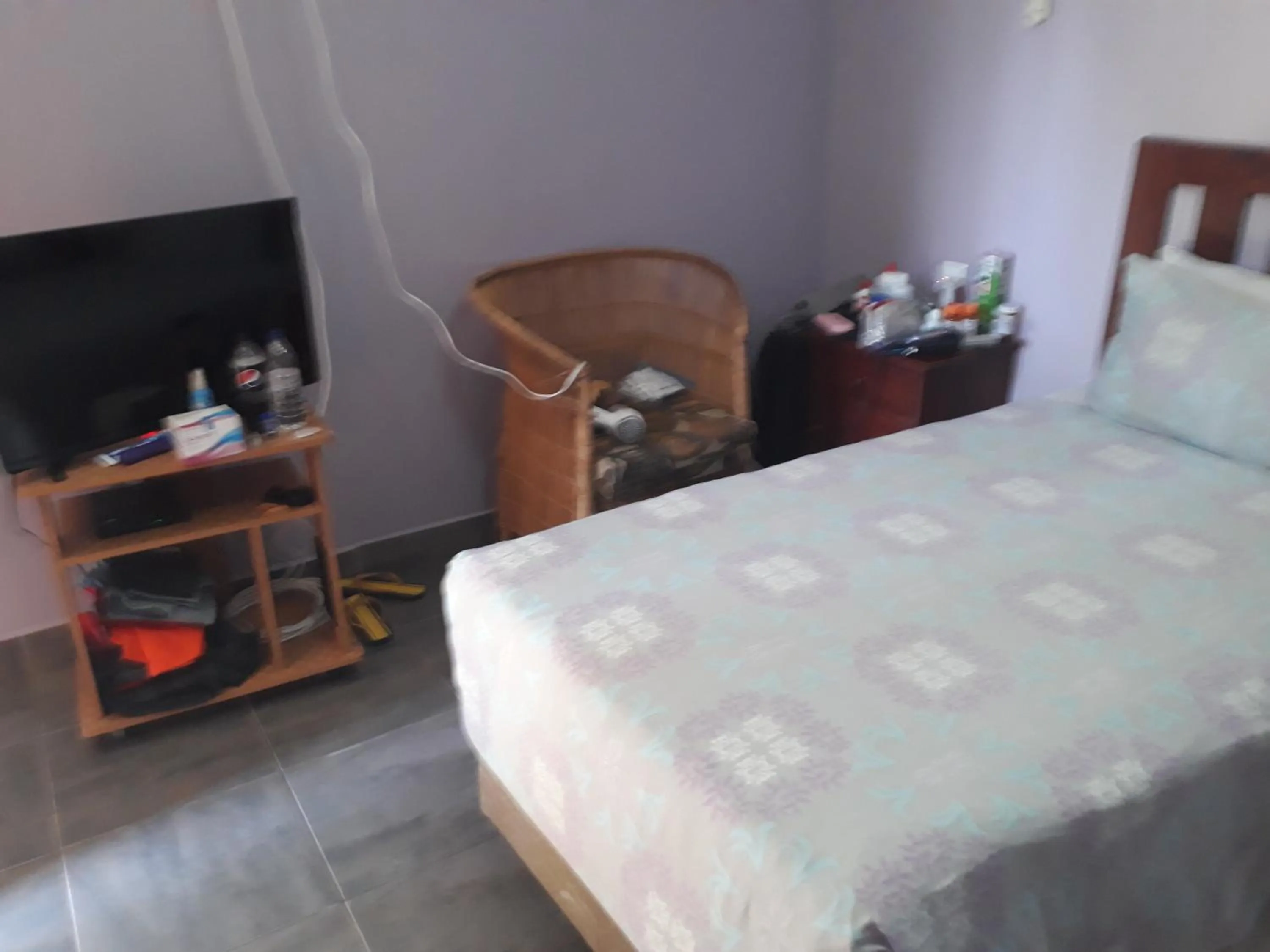 Bed in Gloria's Bed and Breakfast