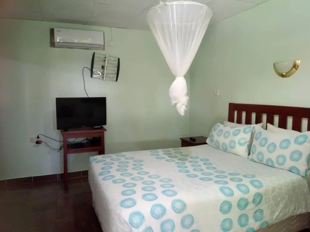 Bed in Gloria's Bed and Breakfast