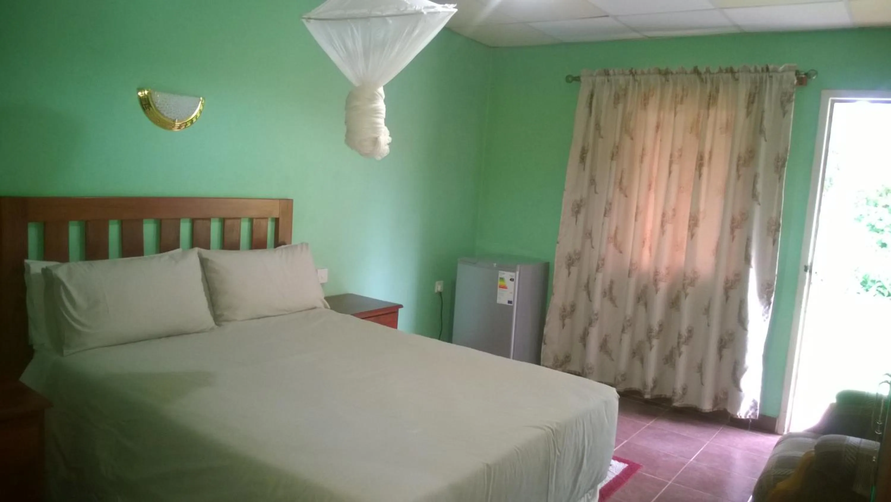 Bed in Gloria's Bed and Breakfast