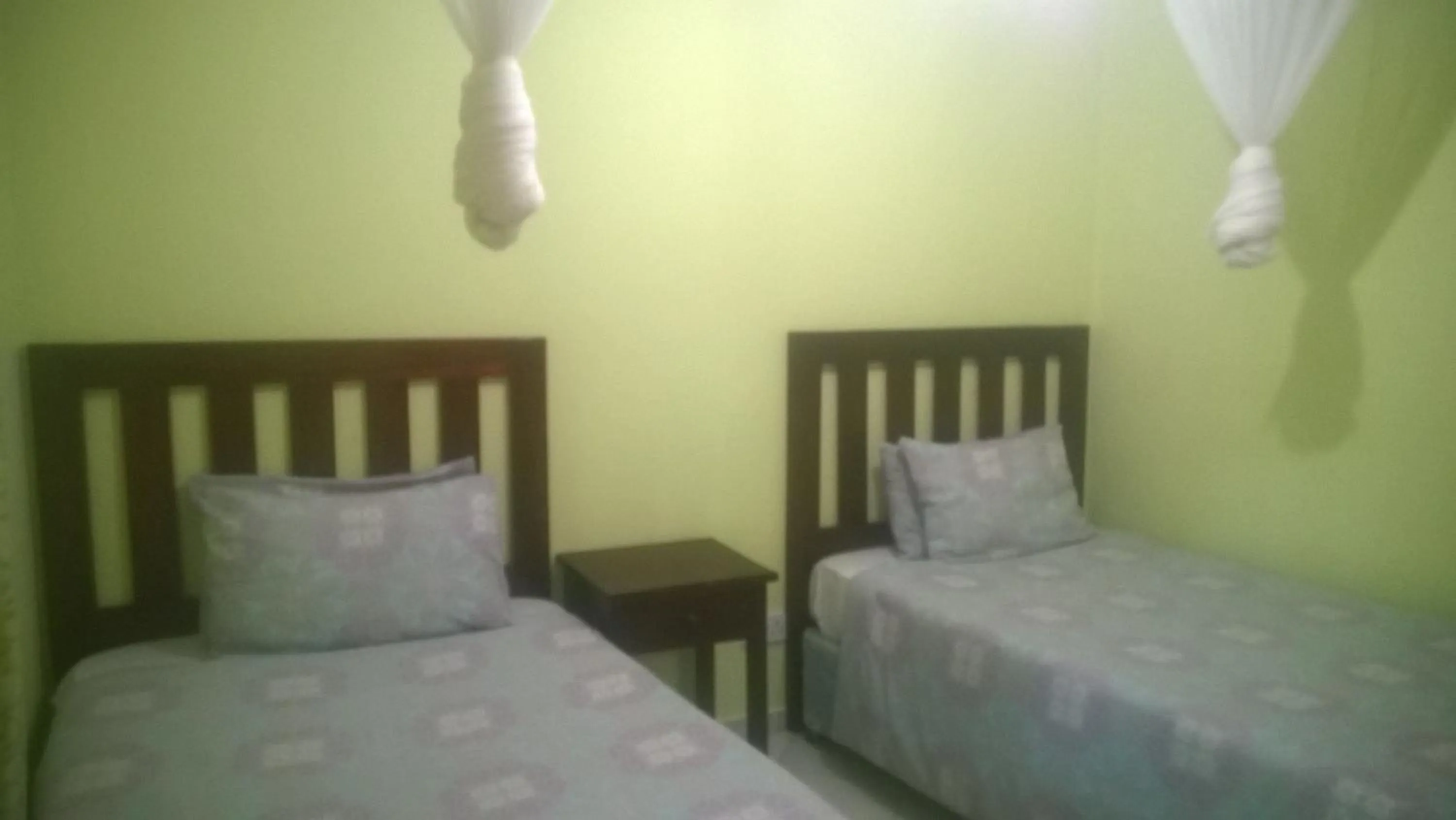 Bed in Gloria's Bed and Breakfast