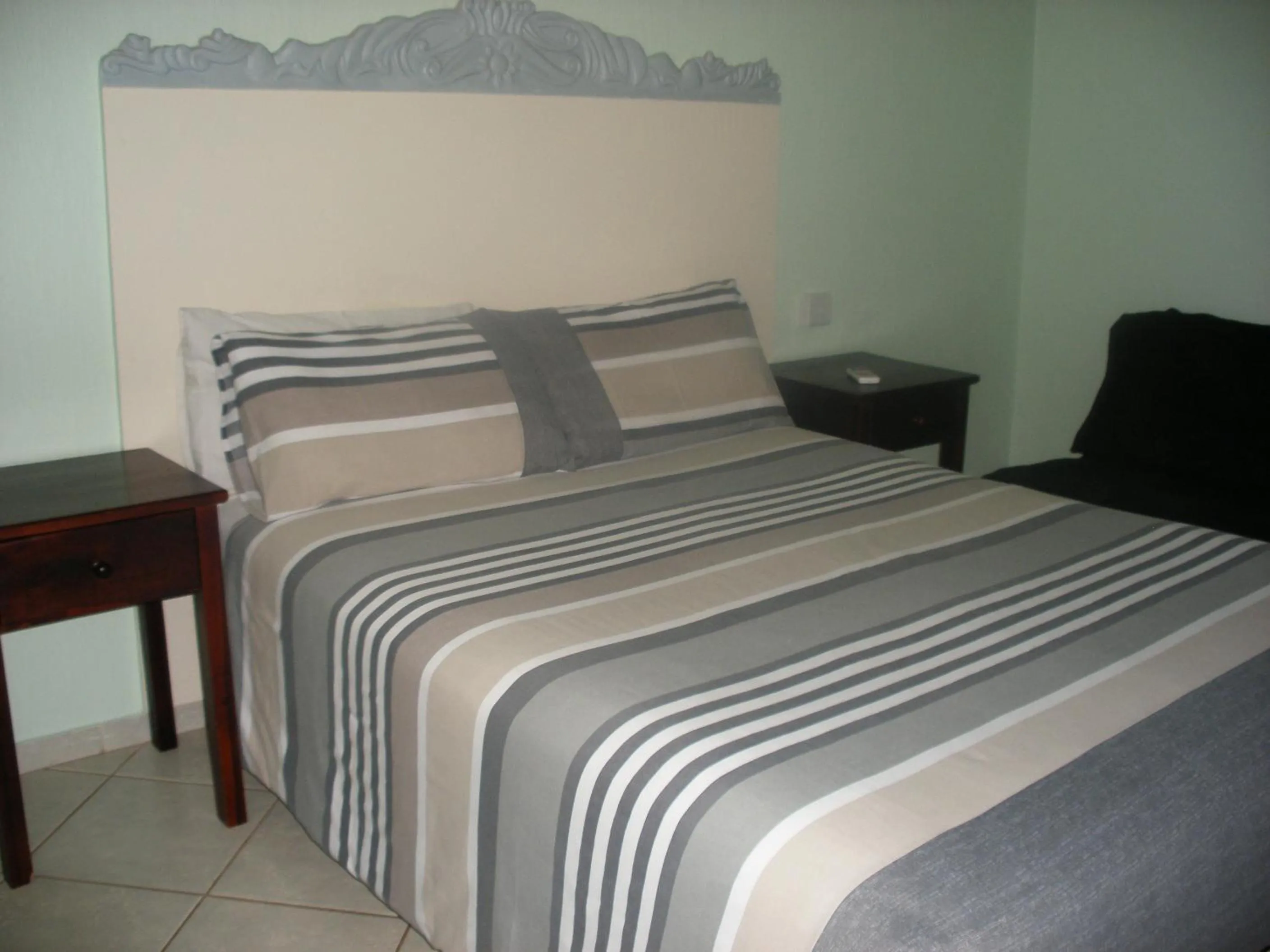 Bed in Gloria's Bed and Breakfast