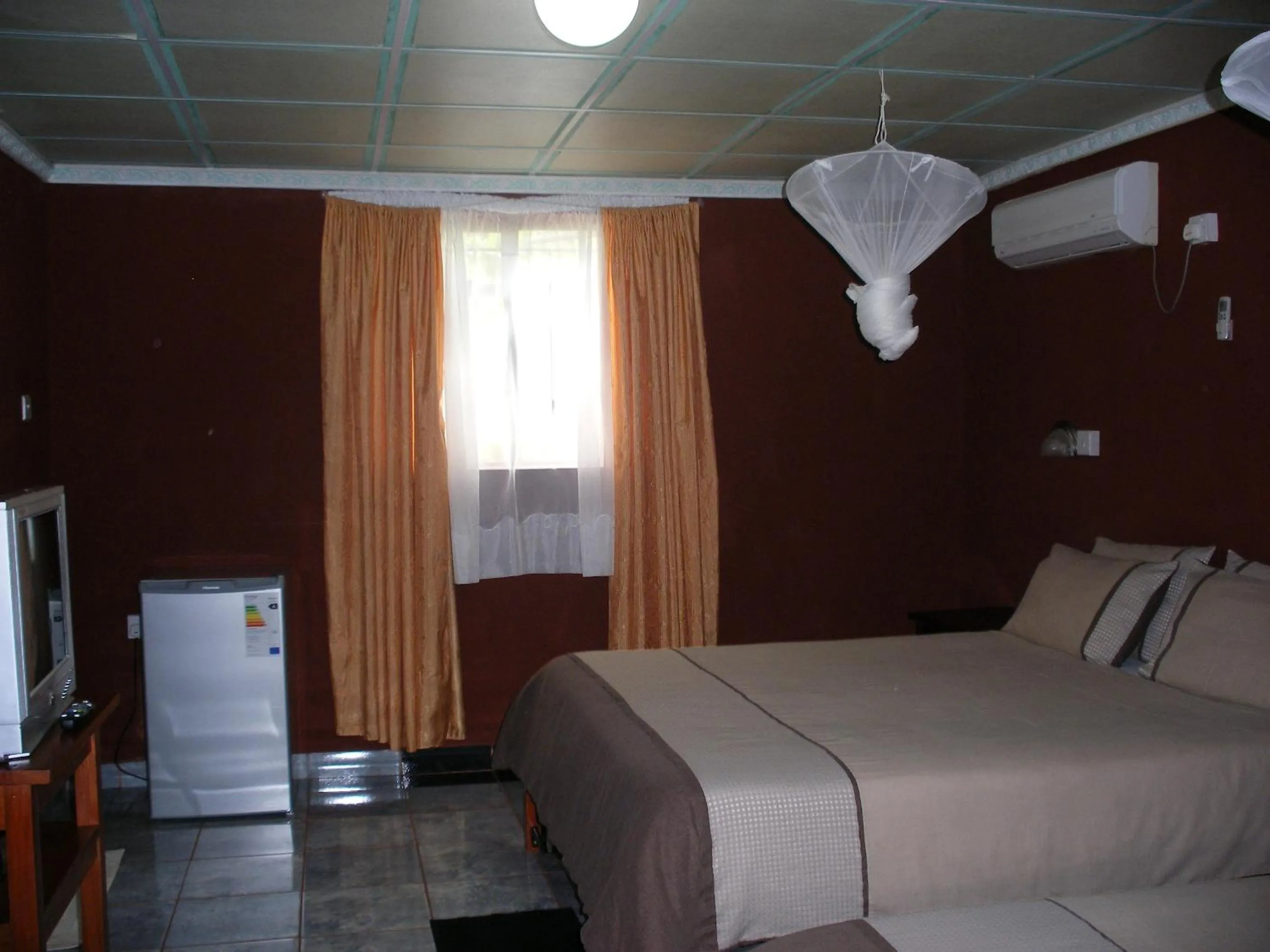 Bed in Gloria's Bed and Breakfast