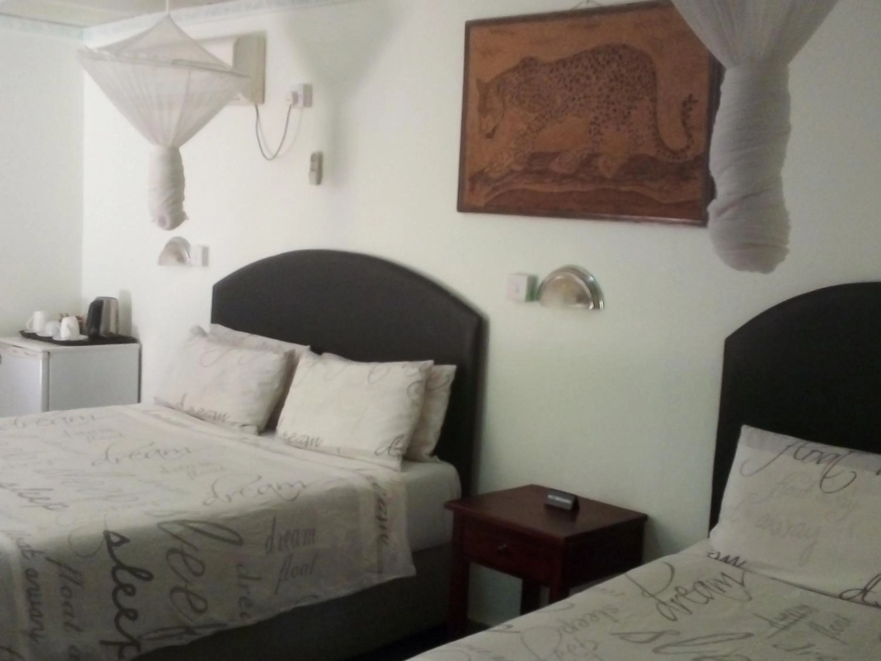 Bed in Gloria's Bed and Breakfast