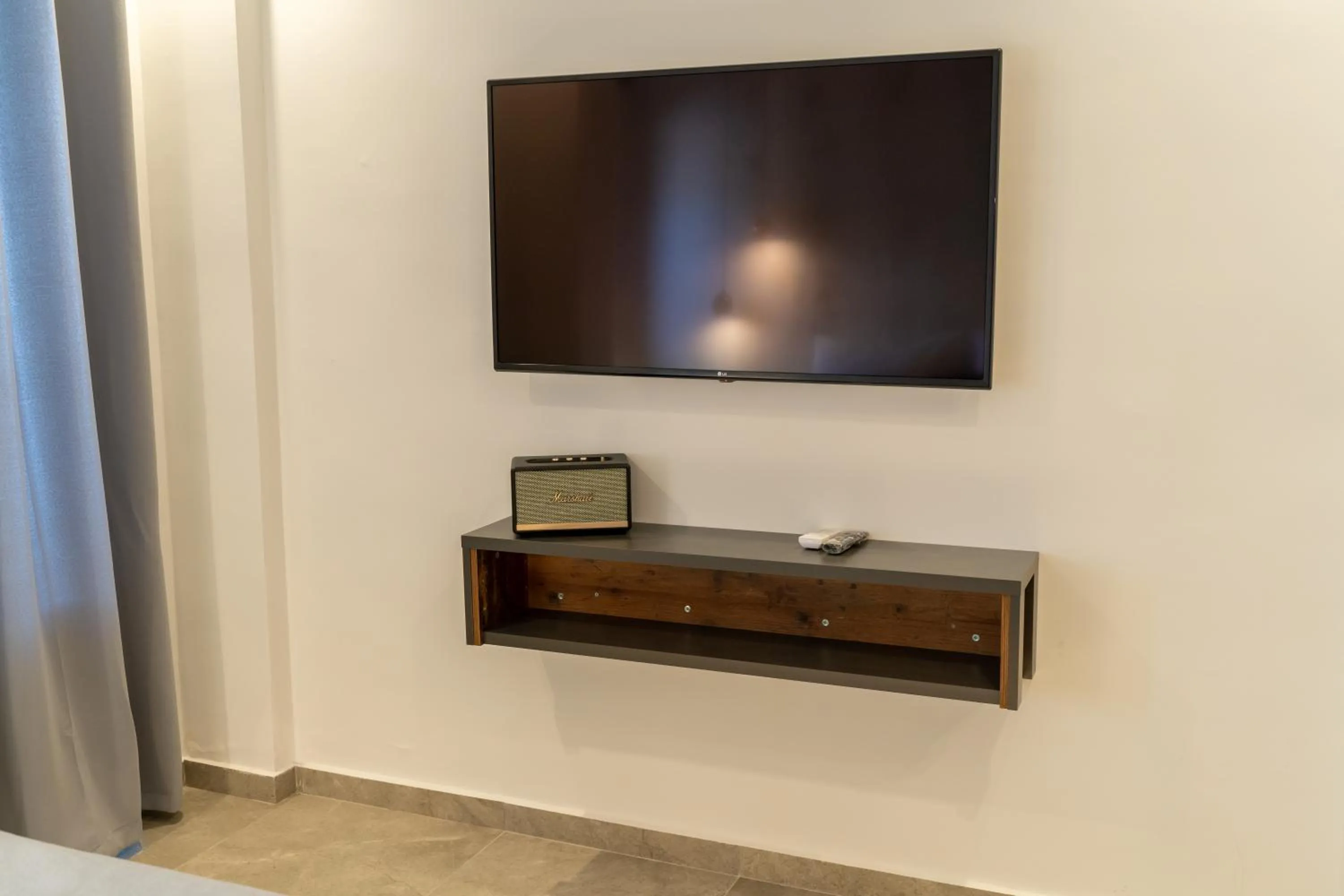 TV and multimedia in George & Joanna Suites Santorini