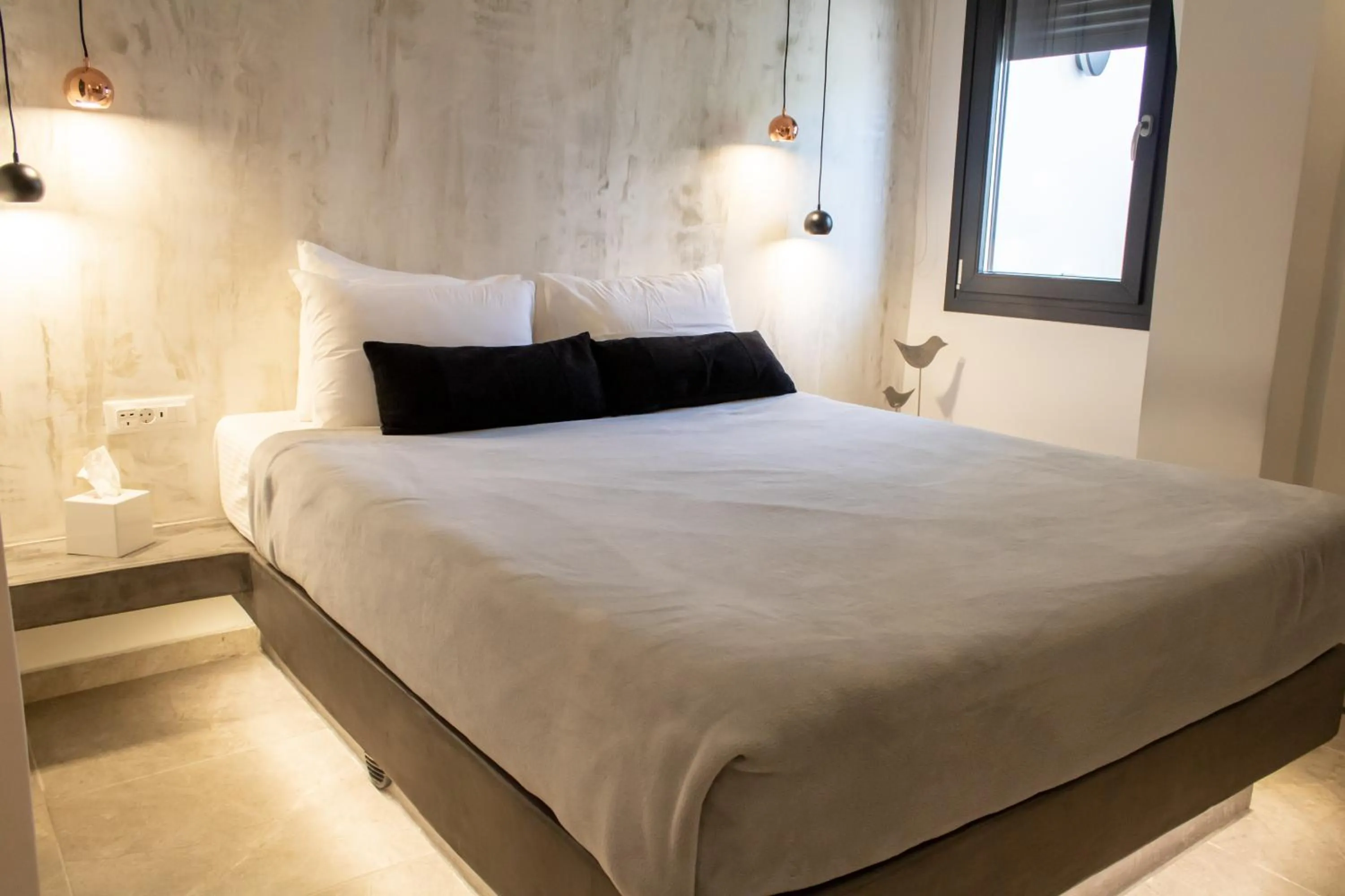 Bed in George & Joanna Suites Santorini