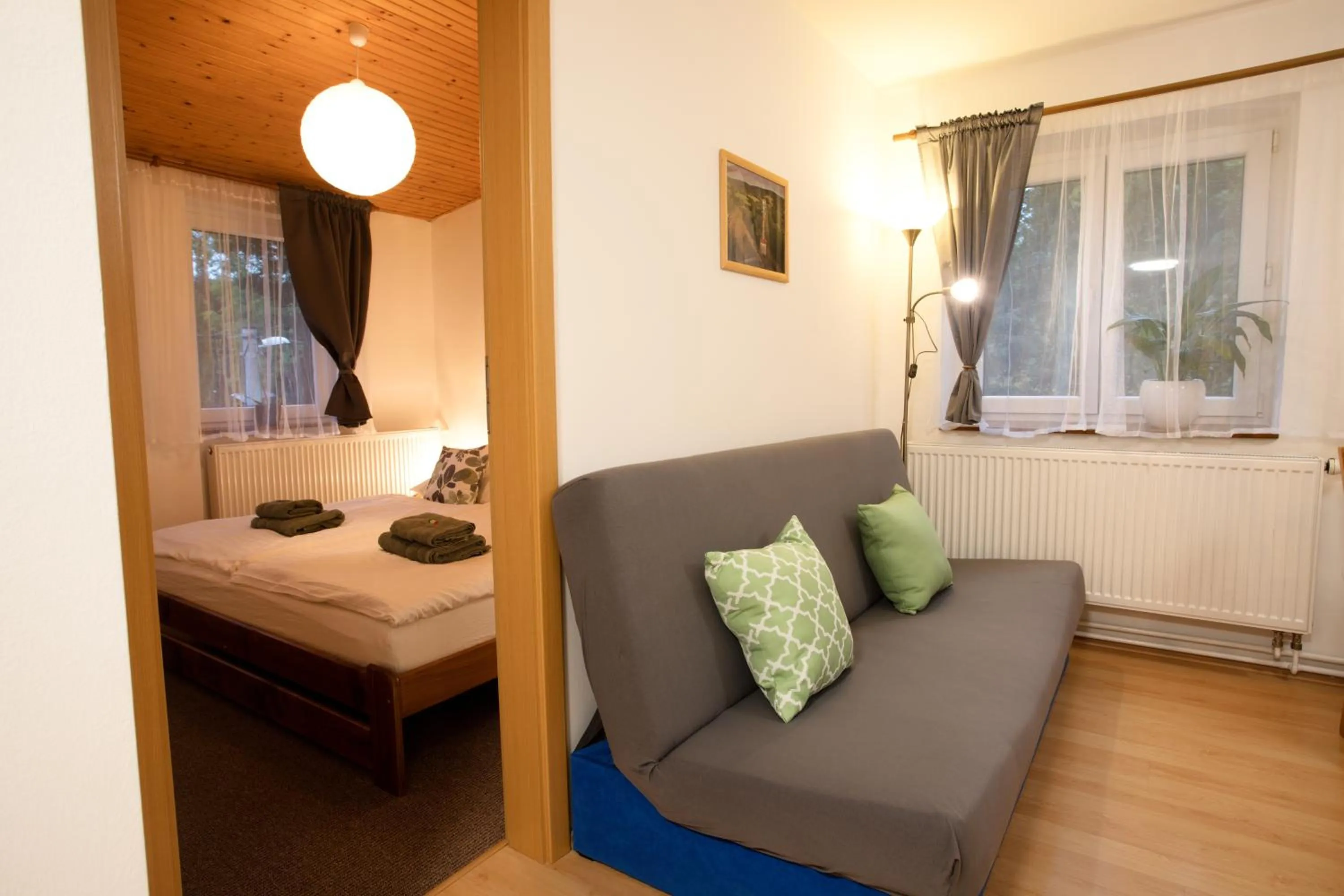 Seating area, Bed in Apartmány Bramborka