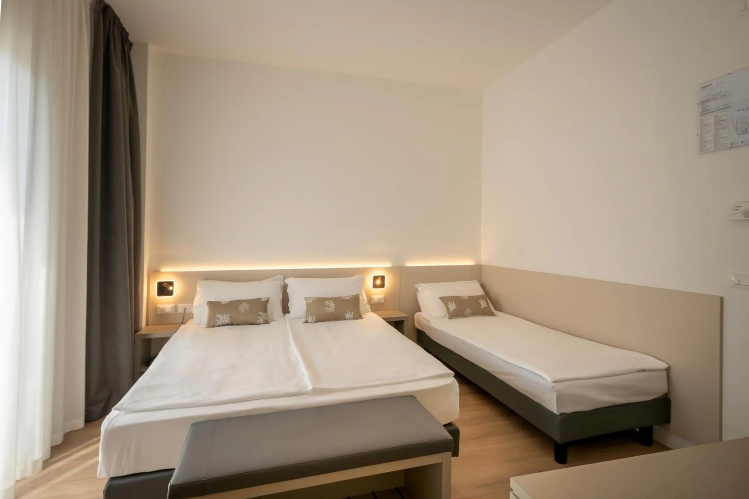 Bed in Hotel Delfino