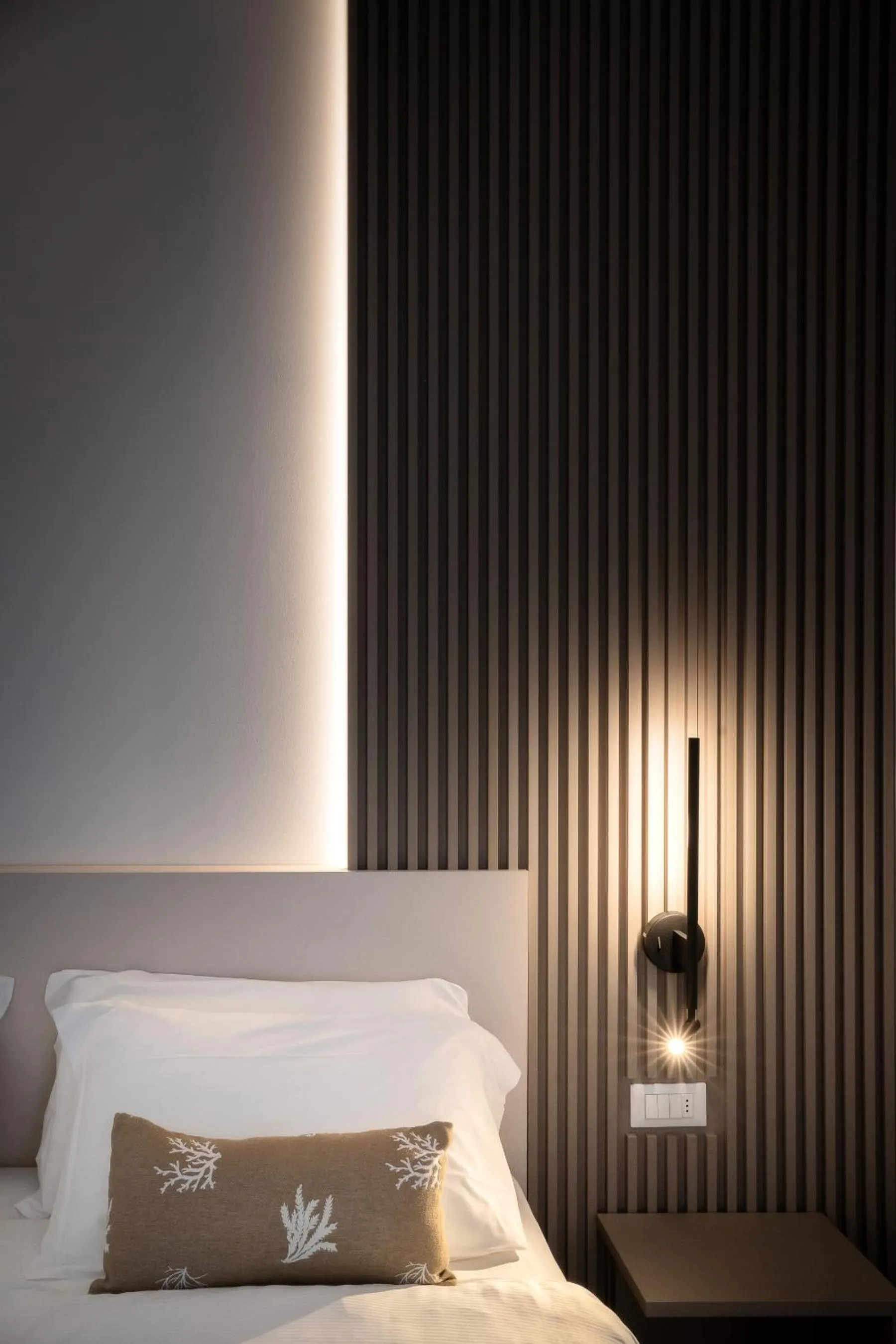Bed in Hotel Delfino