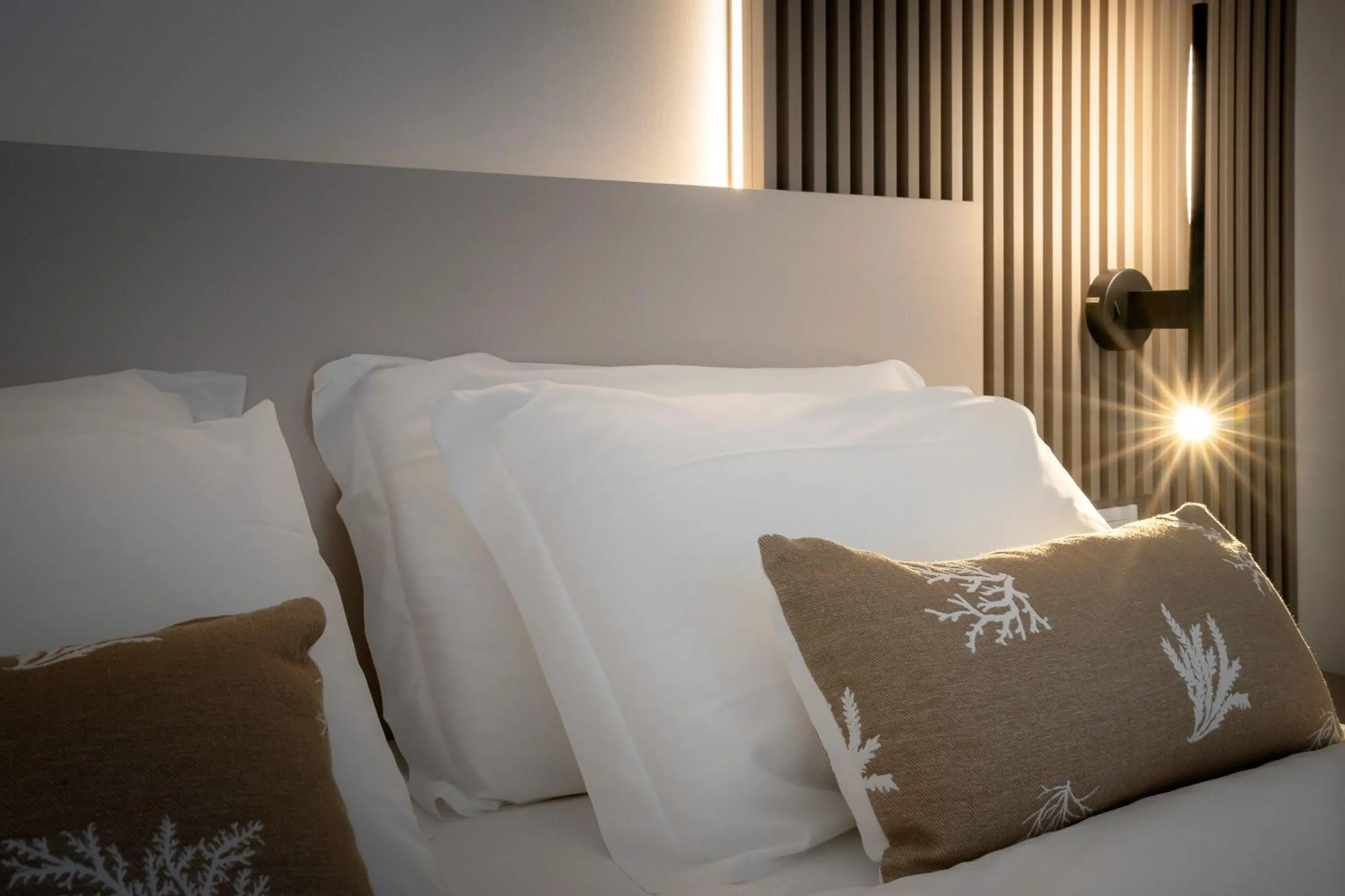 Bed in Hotel Delfino