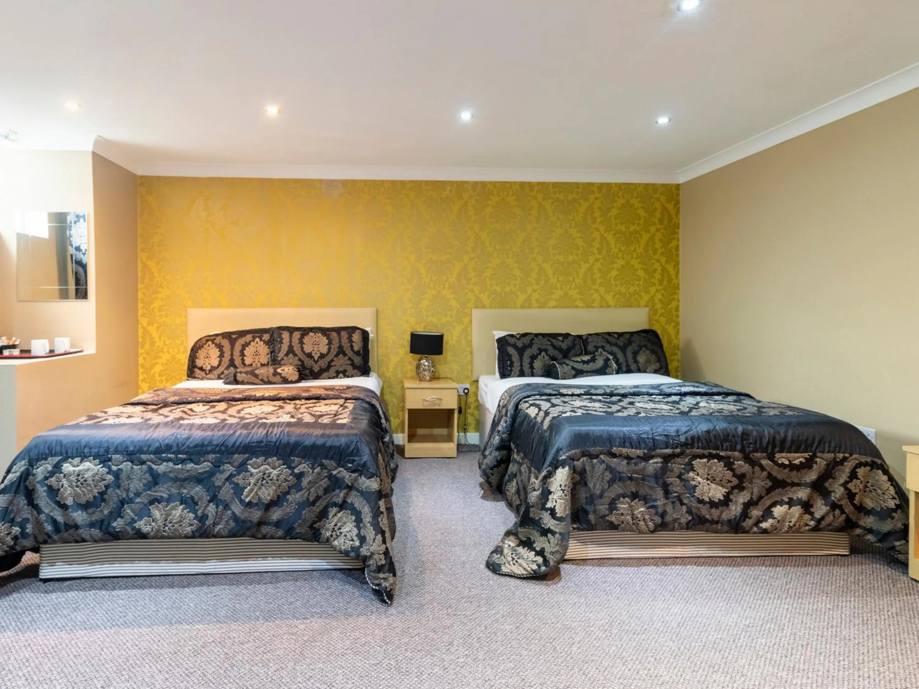 Standard Quadruple Room in Stuart Hotel