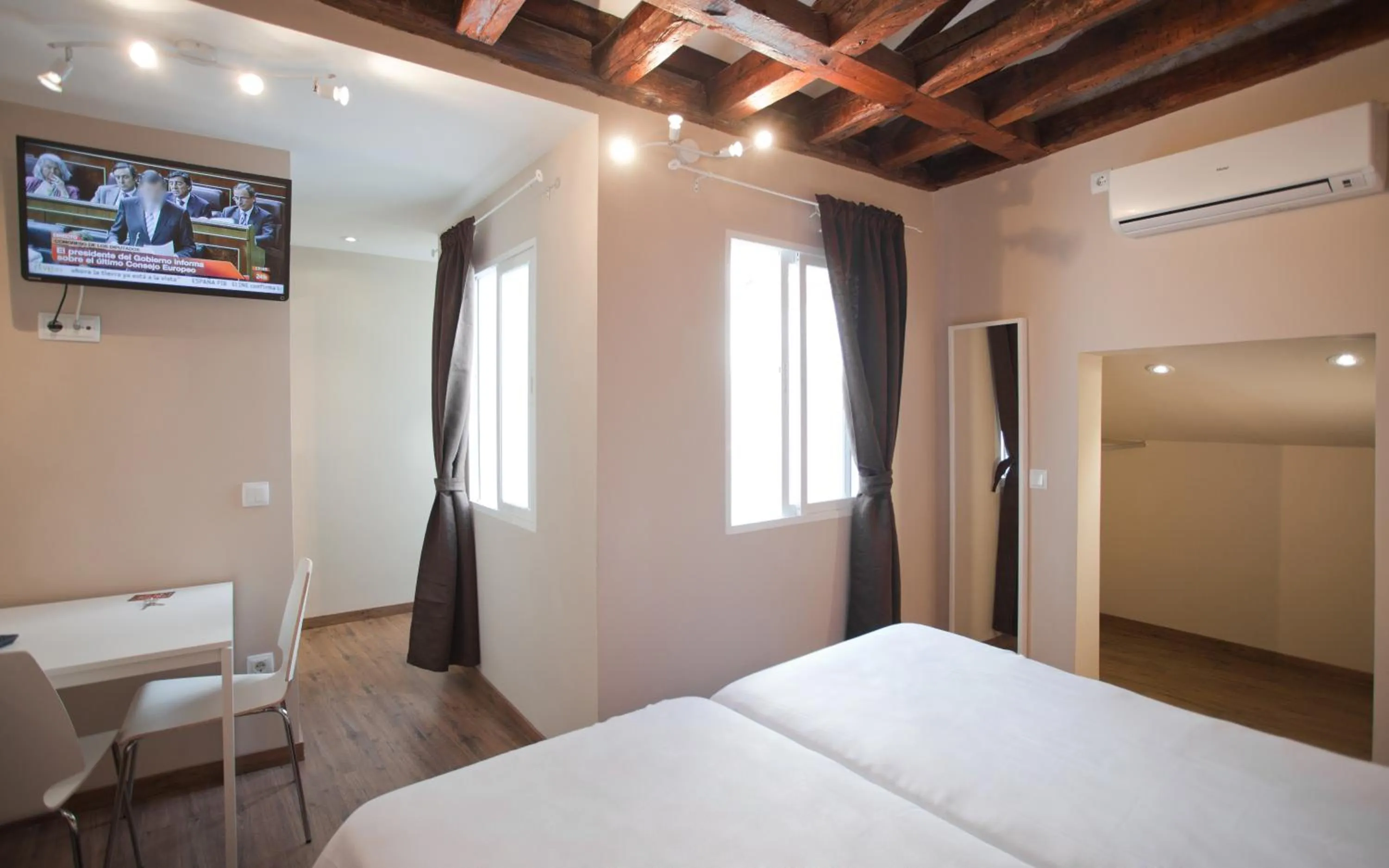 Inner courtyard view, Bed in Suites You Nickel