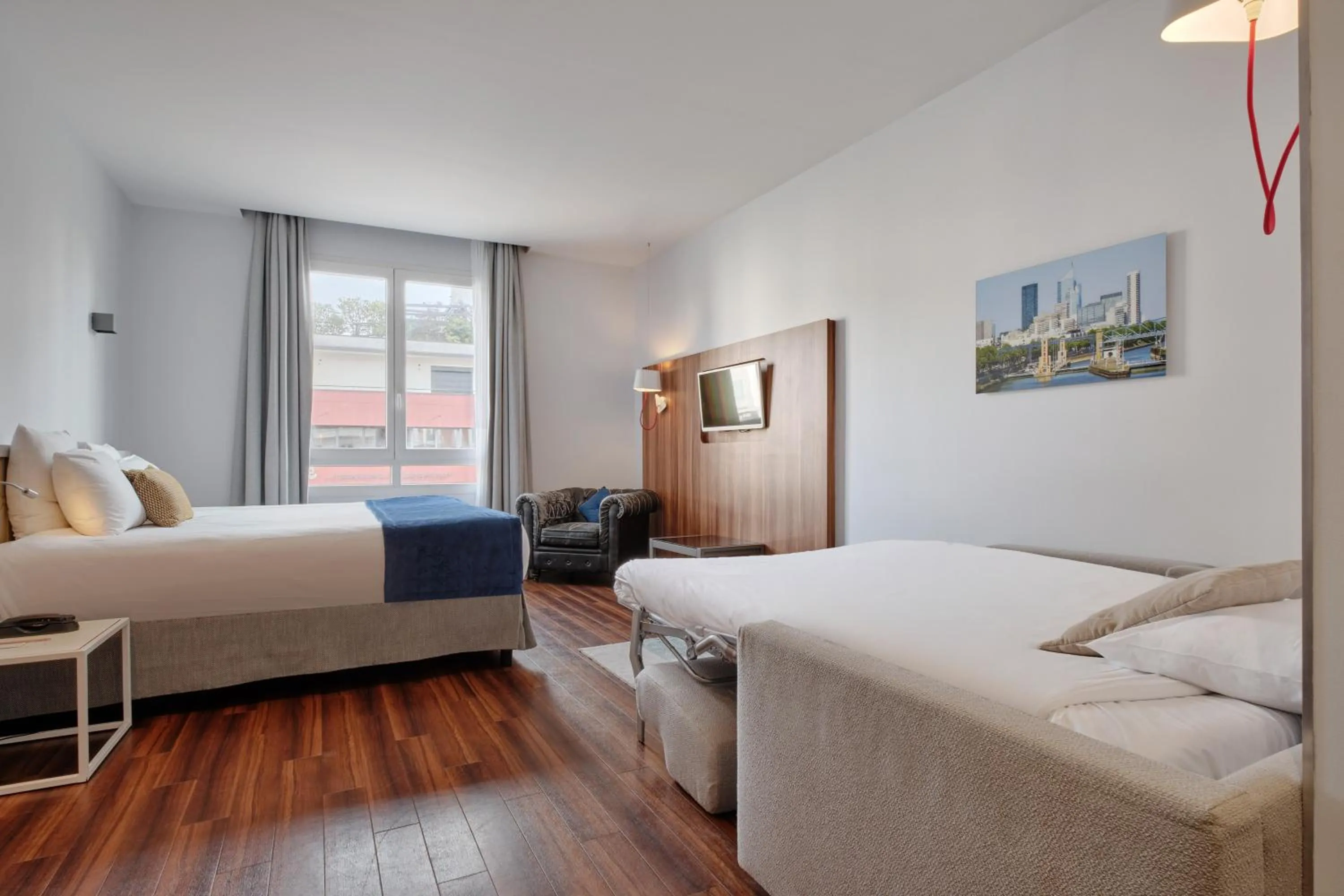 Photo of the whole room, Bed in Hotel Atrium by Happyculture