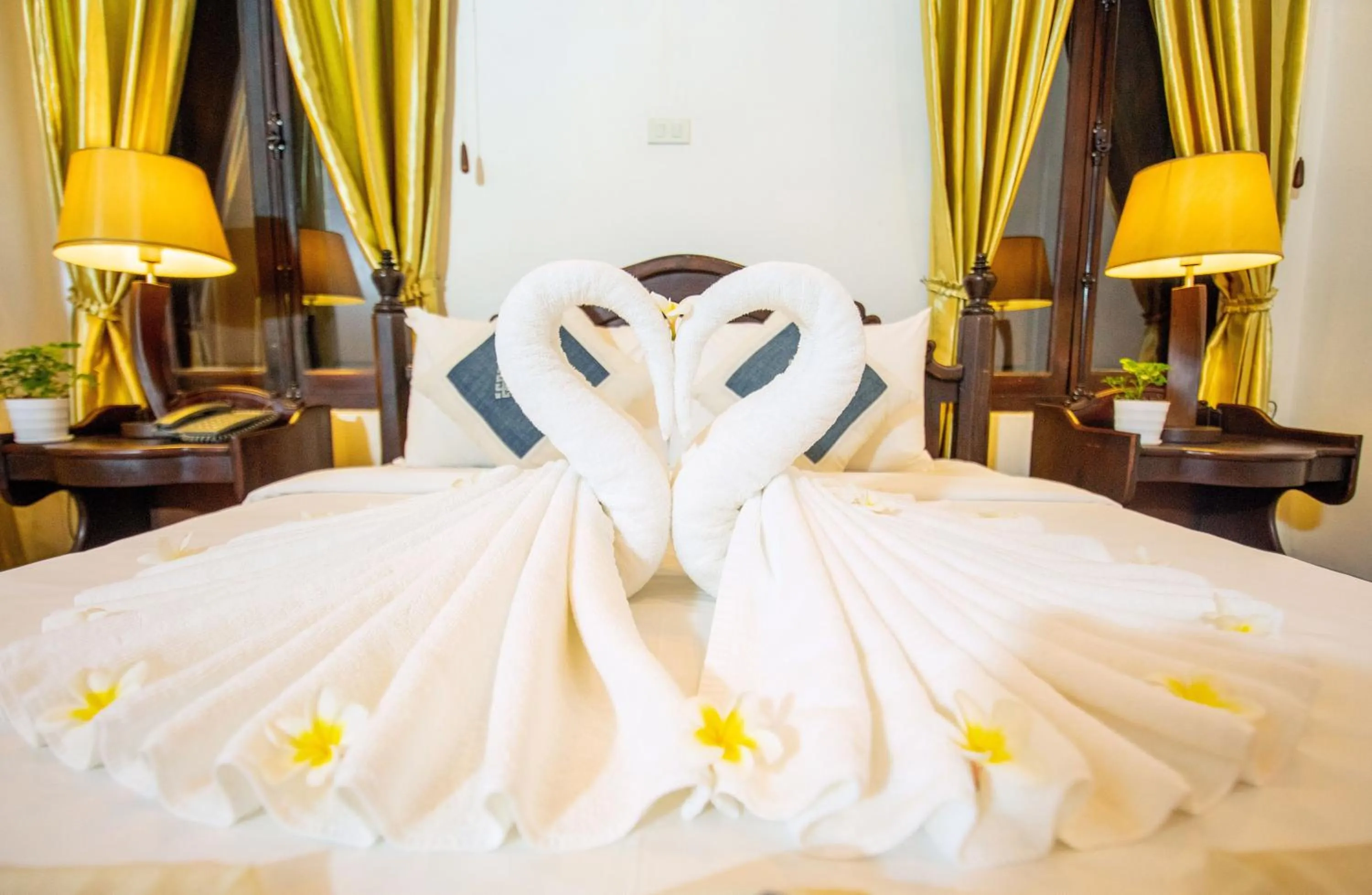 Bed in Treasure Hotel Laos