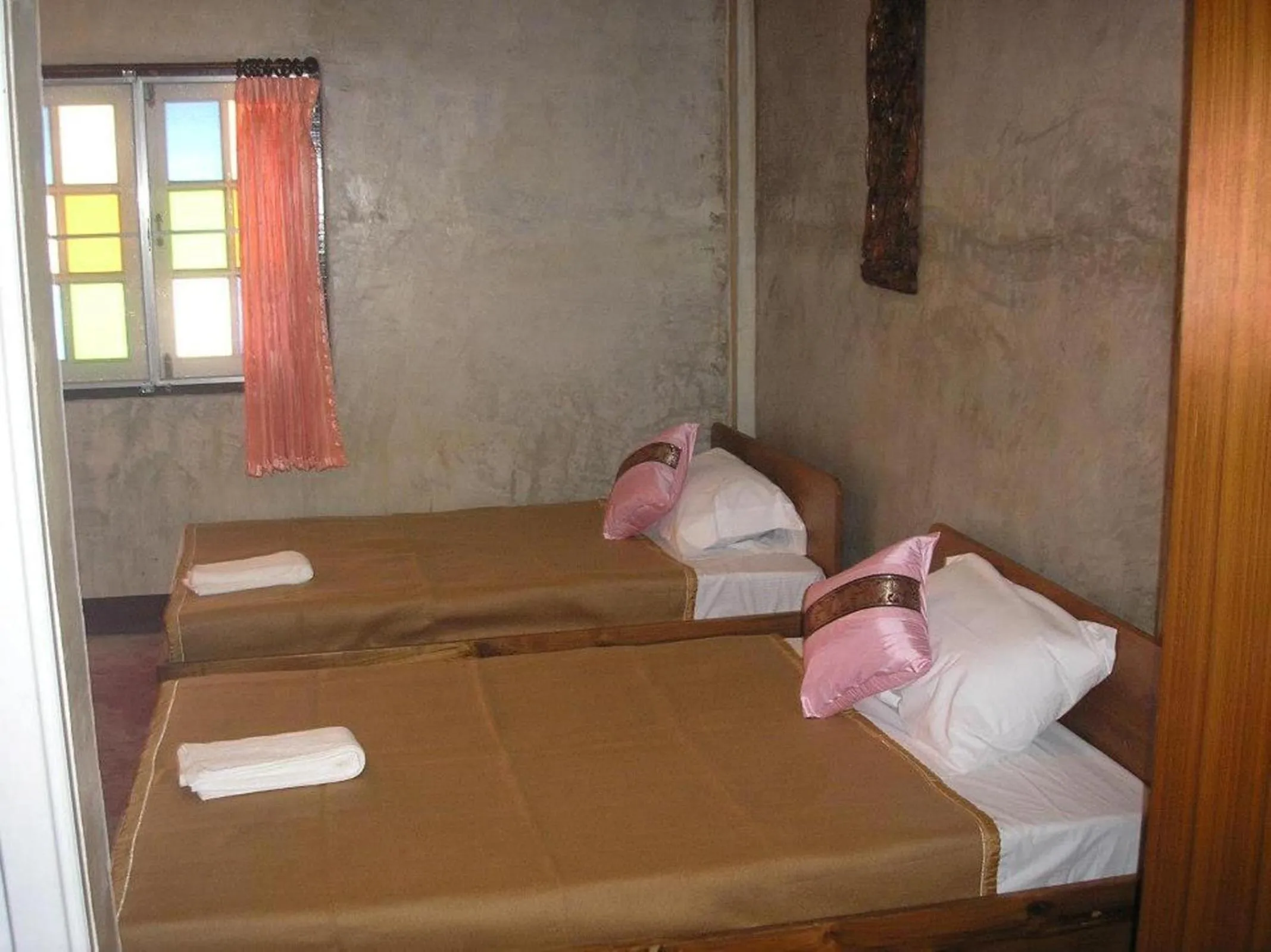 Bed in Tamarind Grand Resort Mae Sariang