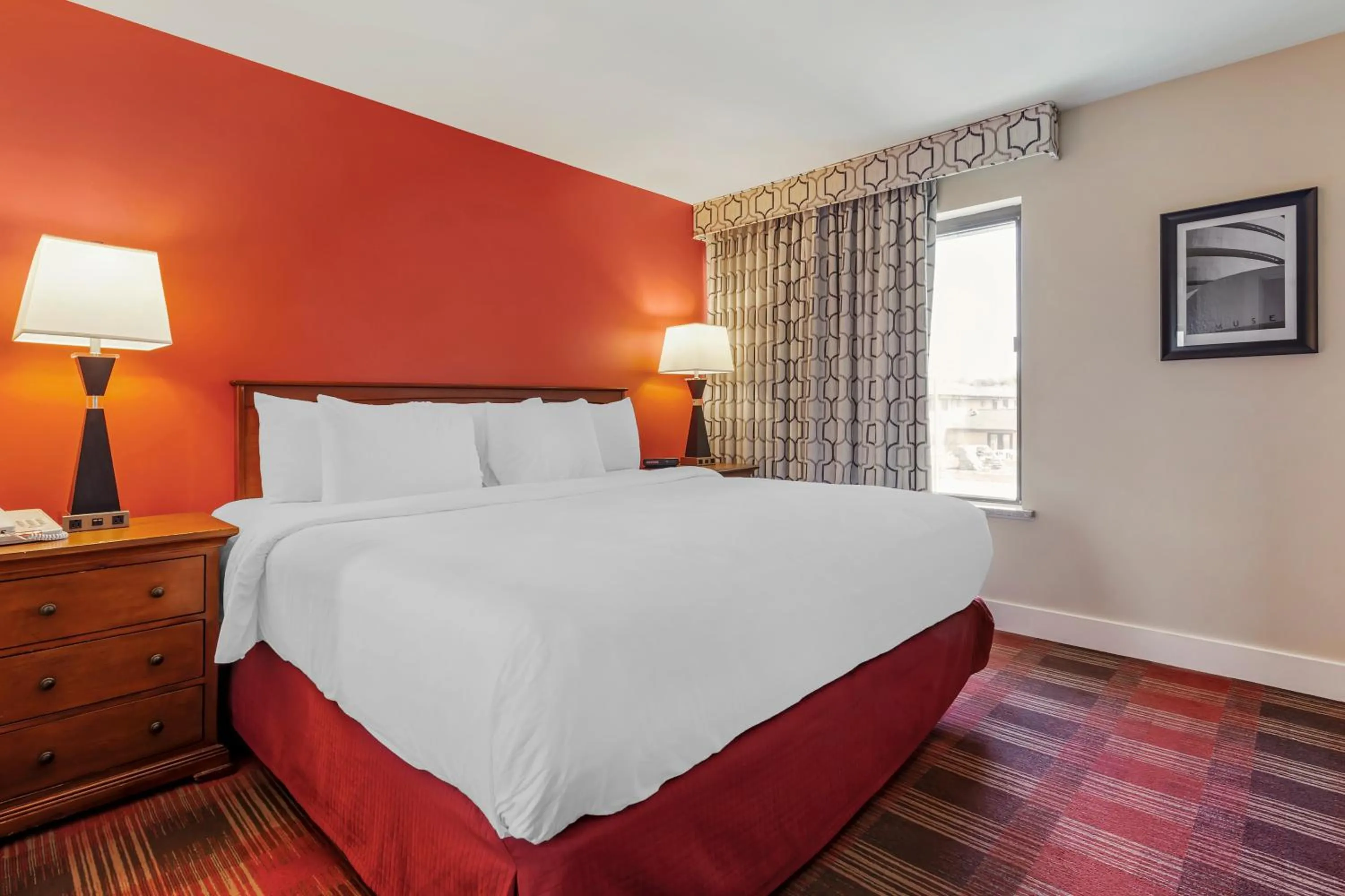 Bed in Polynesian Hotel & Suites