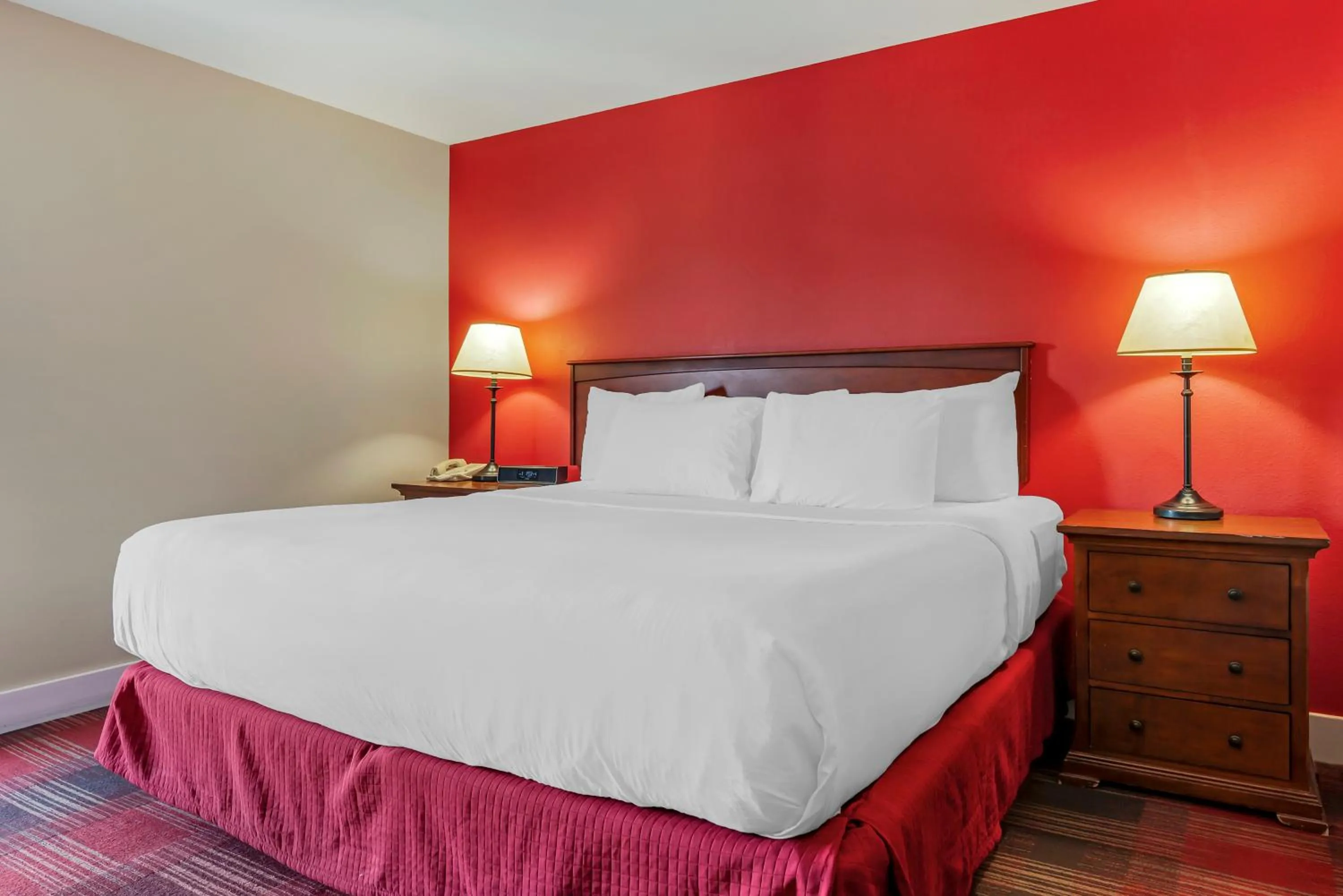 Bed in Polynesian Hotel & Suites