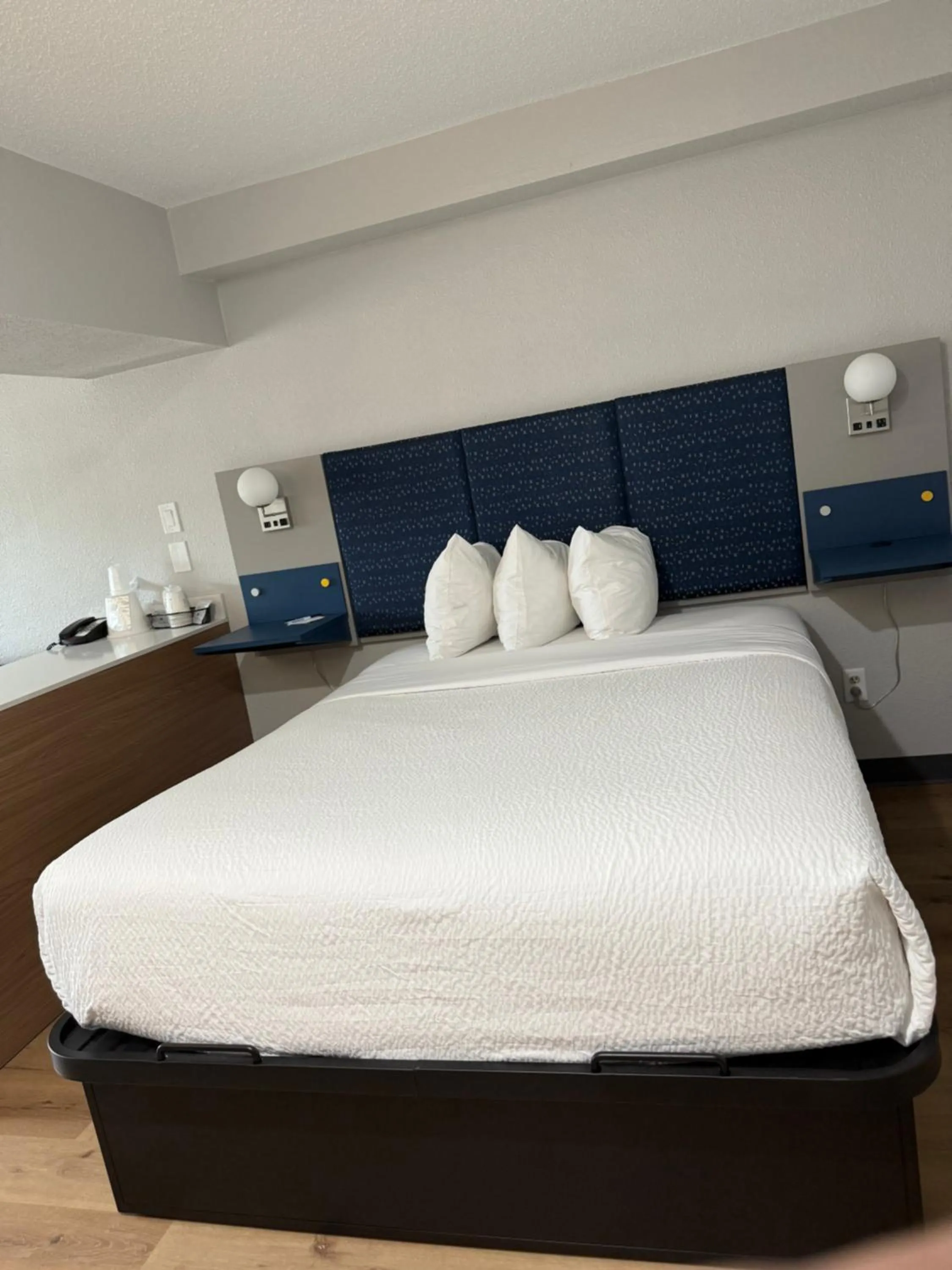 Bed in Microtel Inn & Suites by Wyndham Sioux Falls