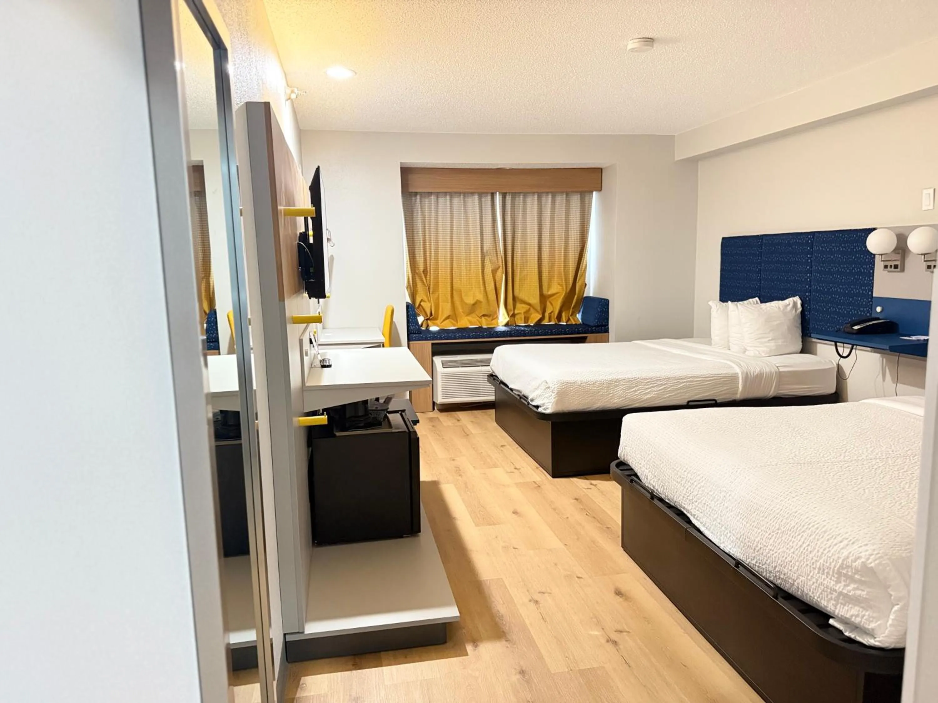 Bed in Microtel Inn & Suites by Wyndham Sioux Falls