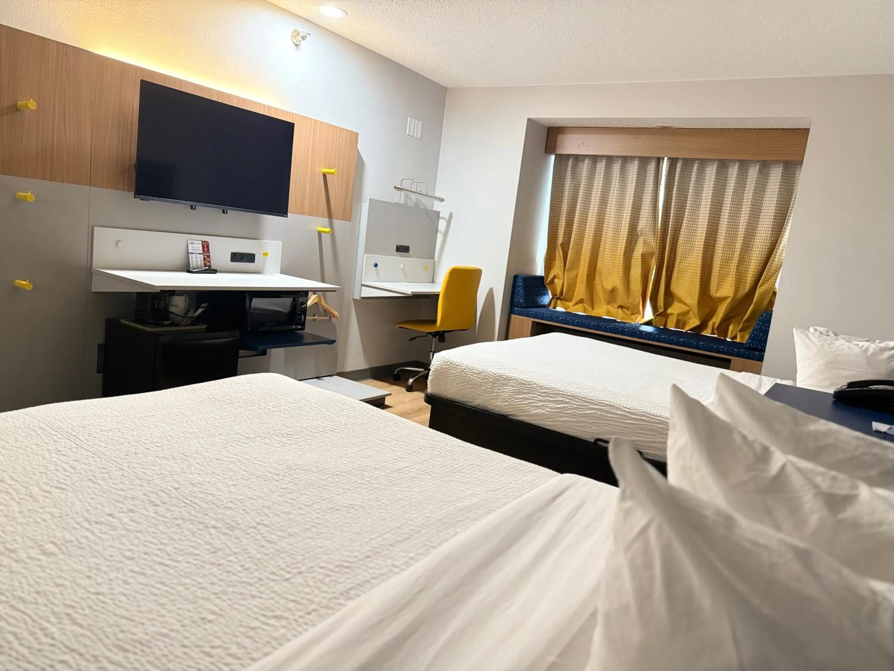 Bed in Microtel Inn & Suites by Wyndham Sioux Falls