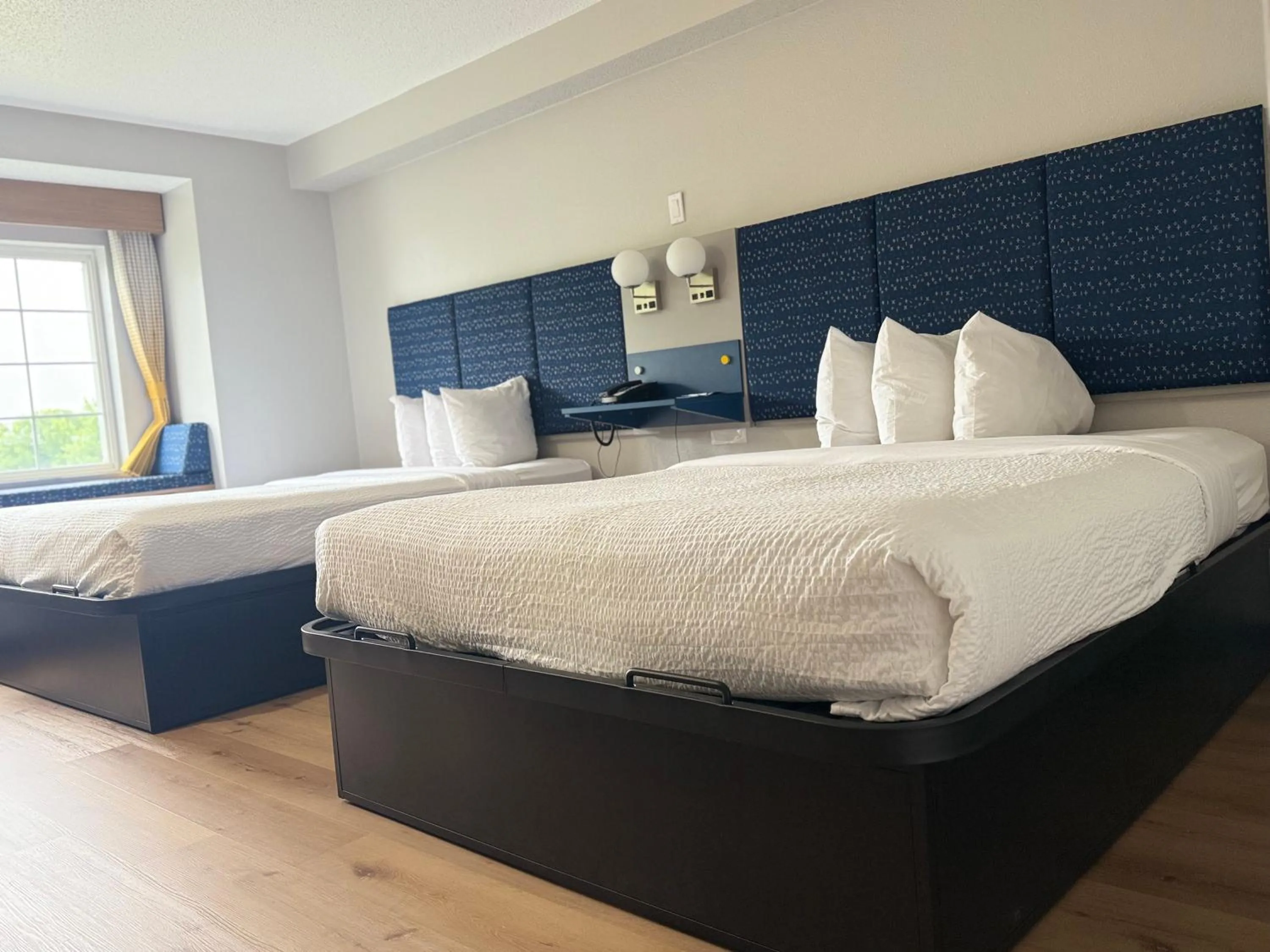 Bed in Microtel Inn & Suites by Wyndham Sioux Falls