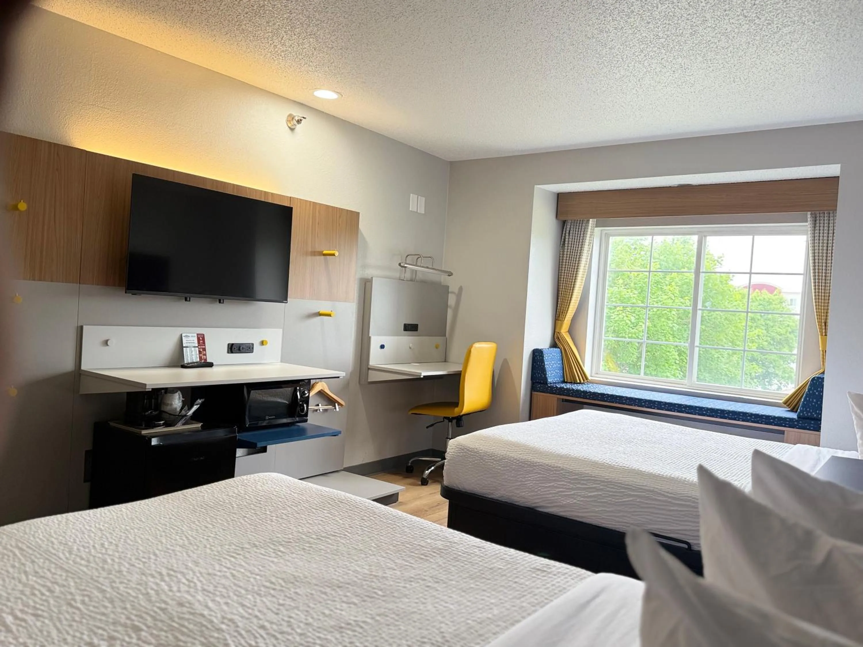 Bed in Microtel Inn & Suites by Wyndham Sioux Falls