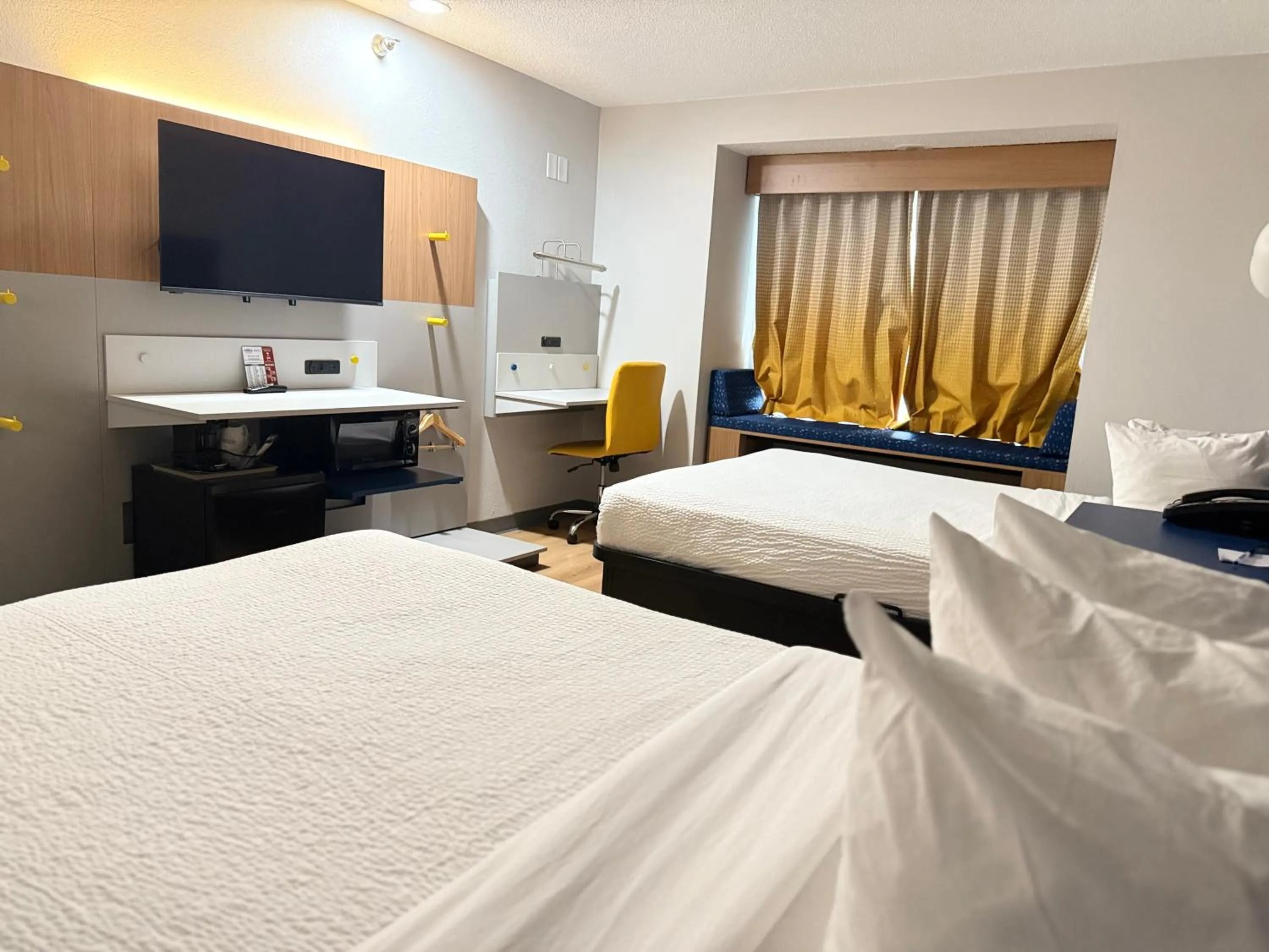 Bed in Microtel Inn & Suites by Wyndham Sioux Falls