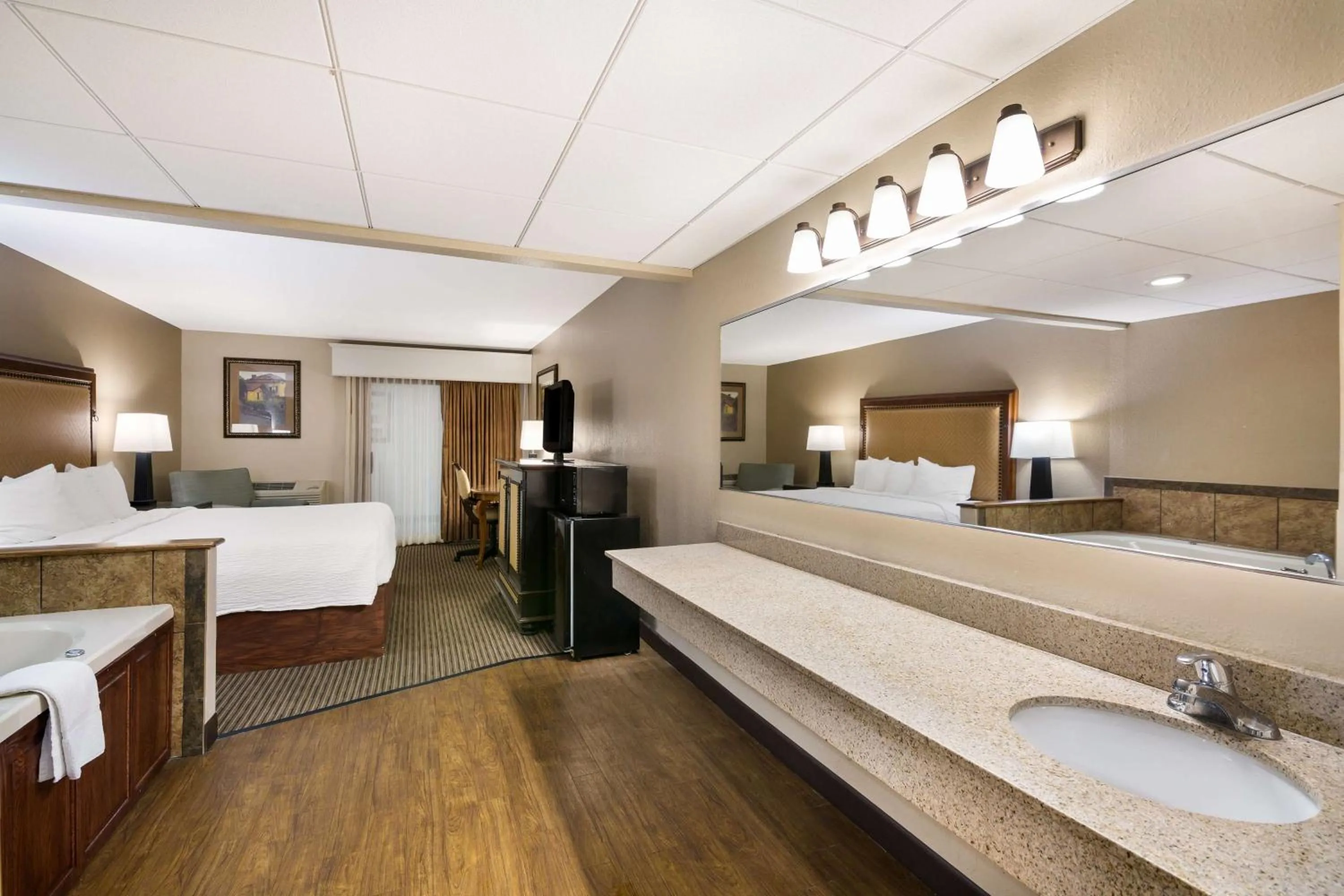 Bathroom, Bed in Revel Hotel Minot - SureStay Collection by Best Western