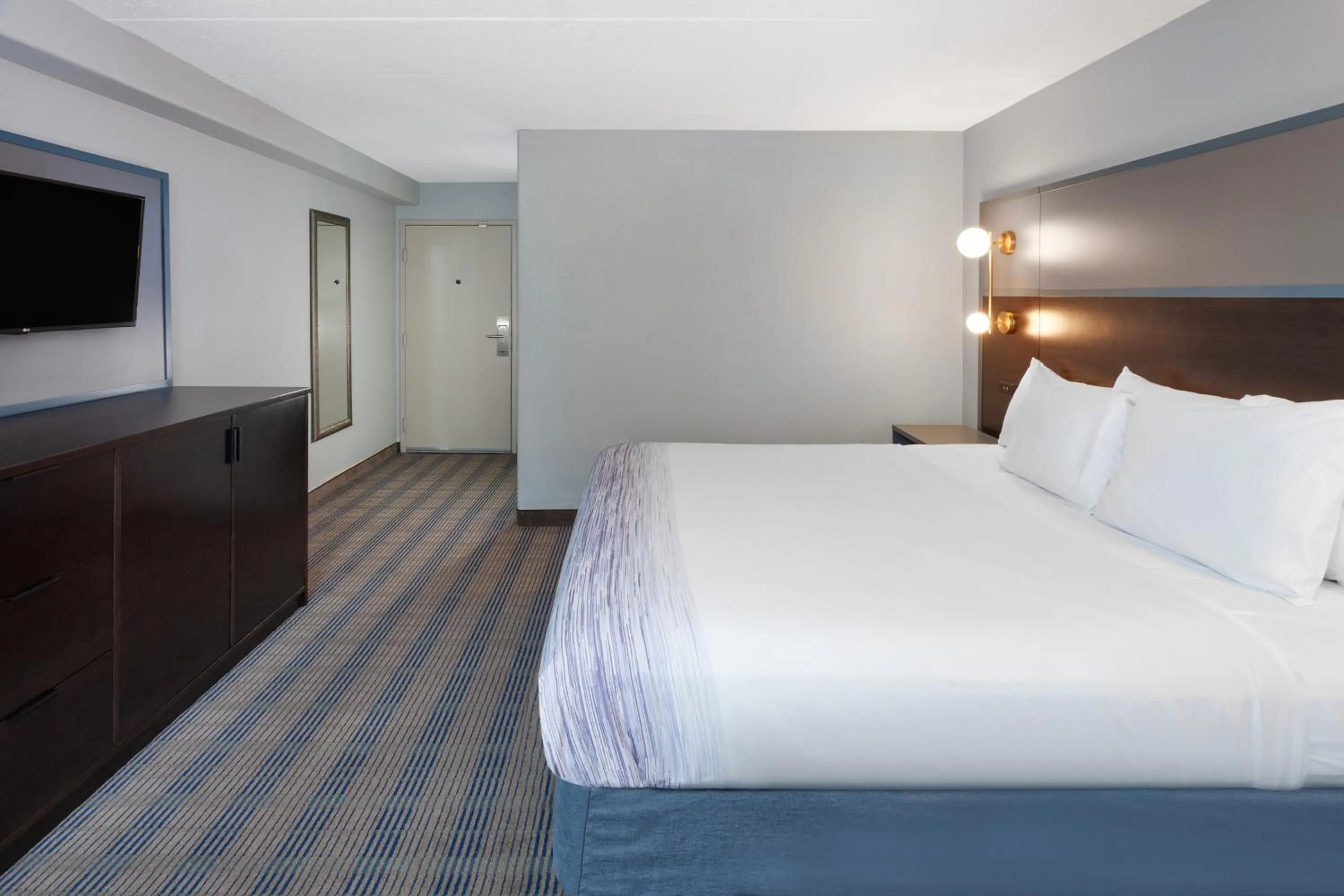 Bed in AmericInn by Wyndham Peoria