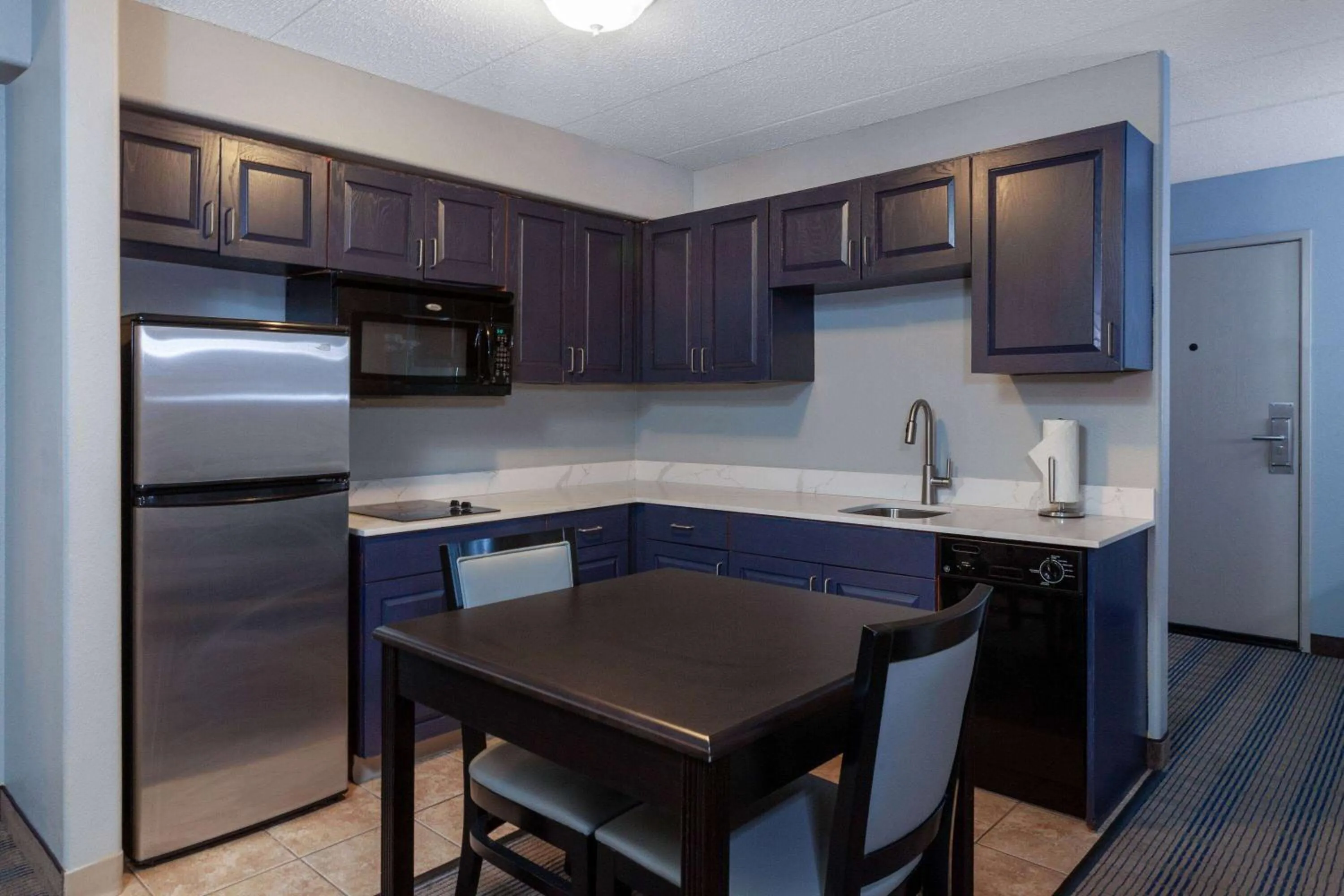 Bed in AmericInn by Wyndham Peoria