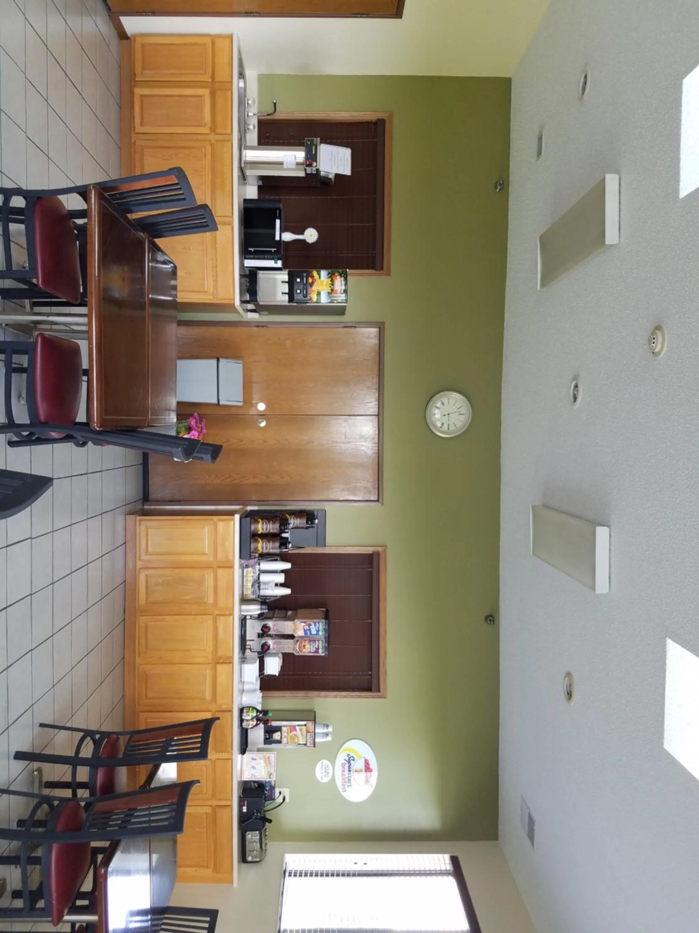 Communal lounge/ TV room in Super 8 by Wyndham DeKalb IL