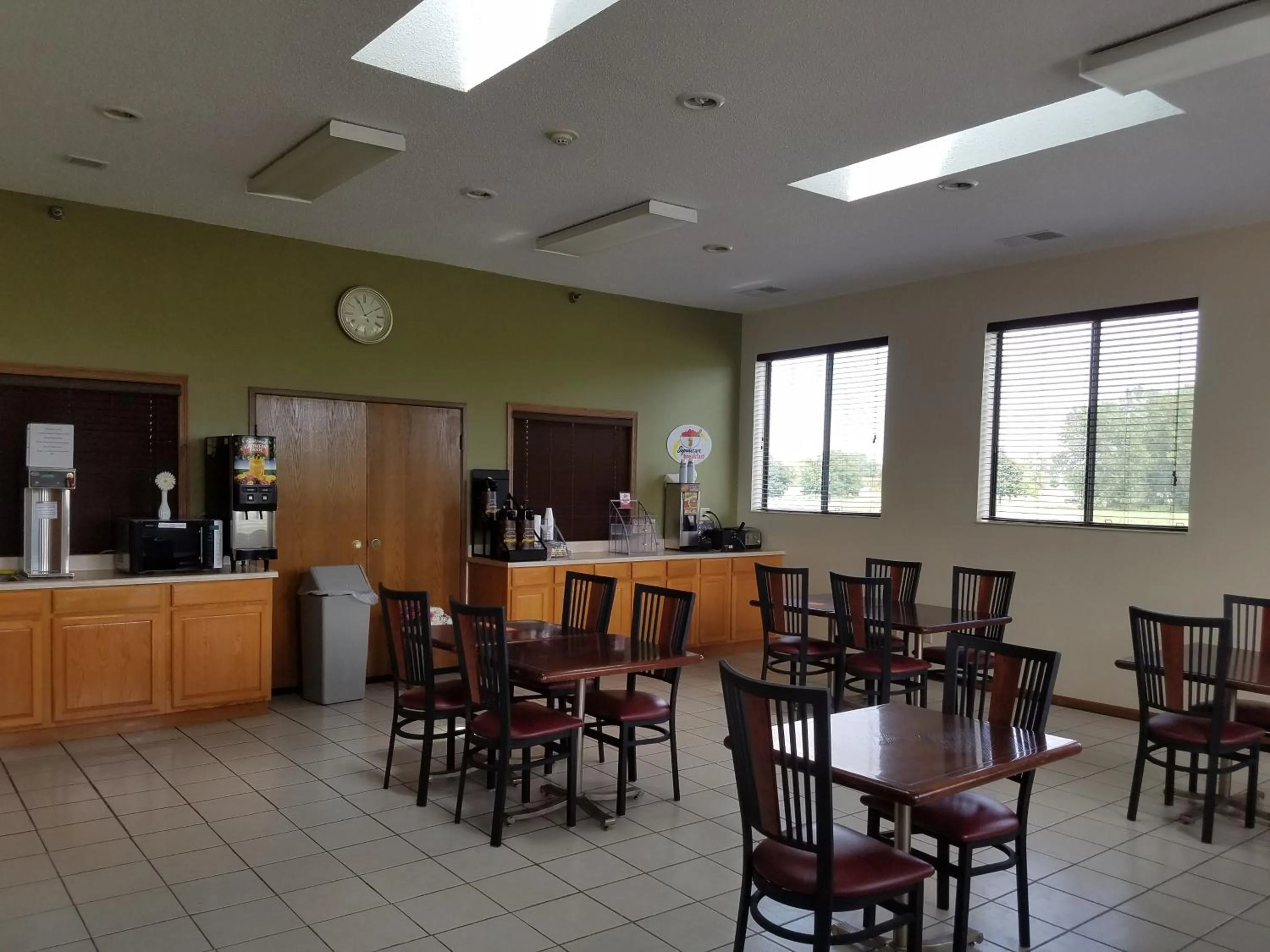 Communal lounge/ TV room in Super 8 by Wyndham DeKalb IL