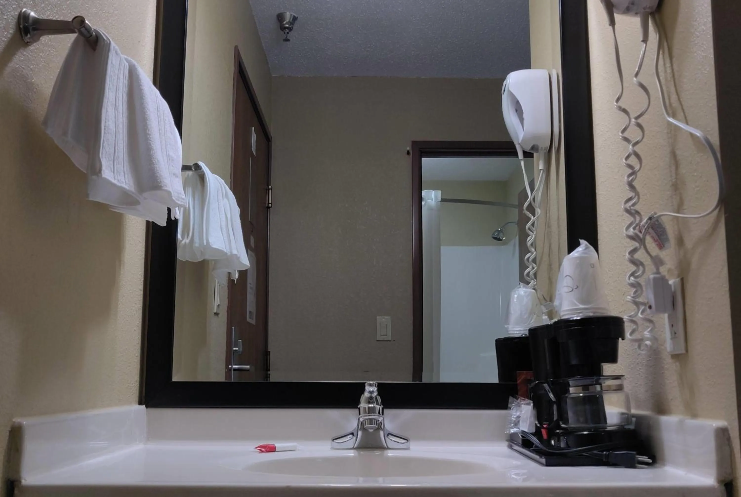 Bathroom in Super 8 by Wyndham DeKalb IL