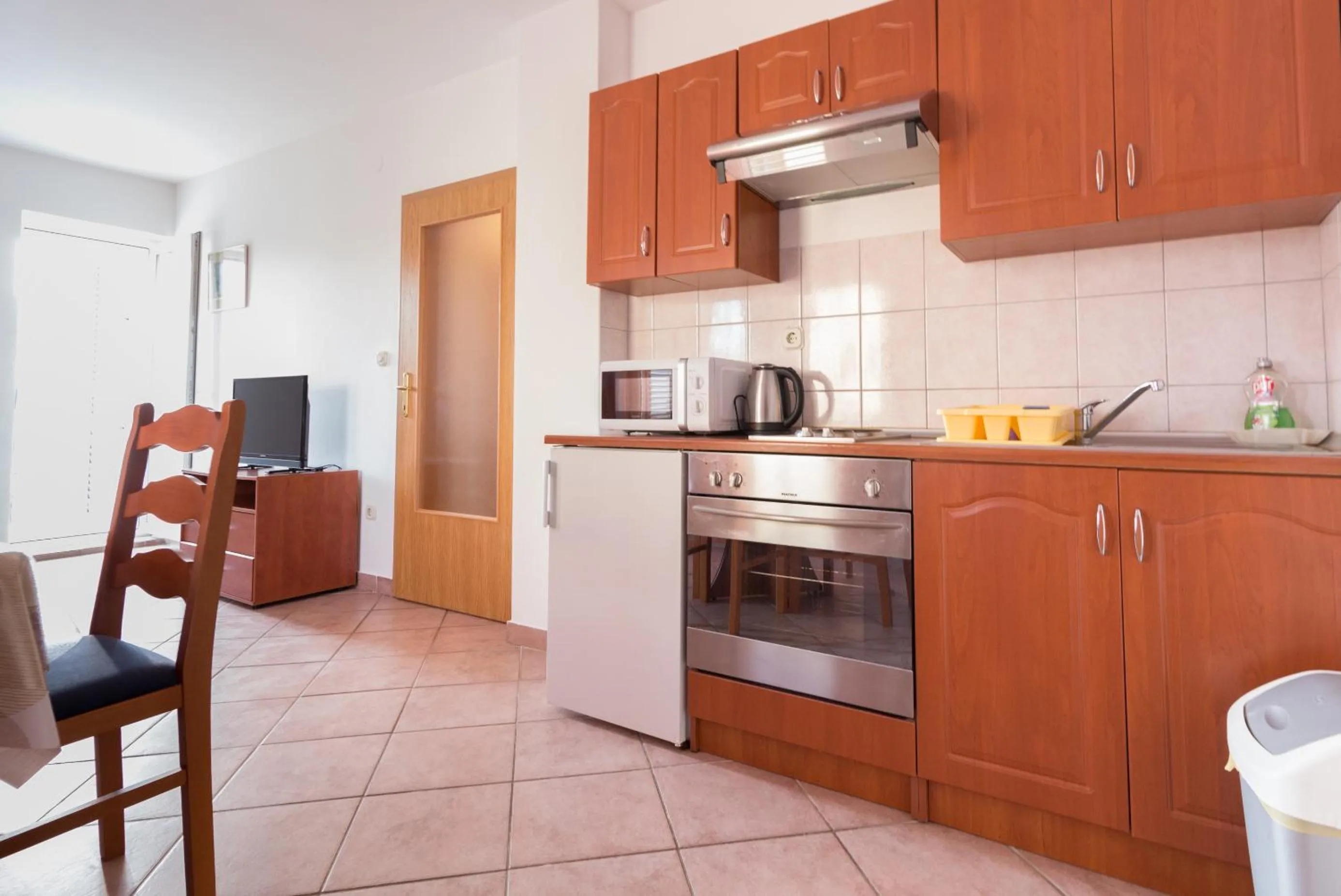Kitchen or kitchenette in Apartments Sunset near the sandy beach - by TA Leut Agency