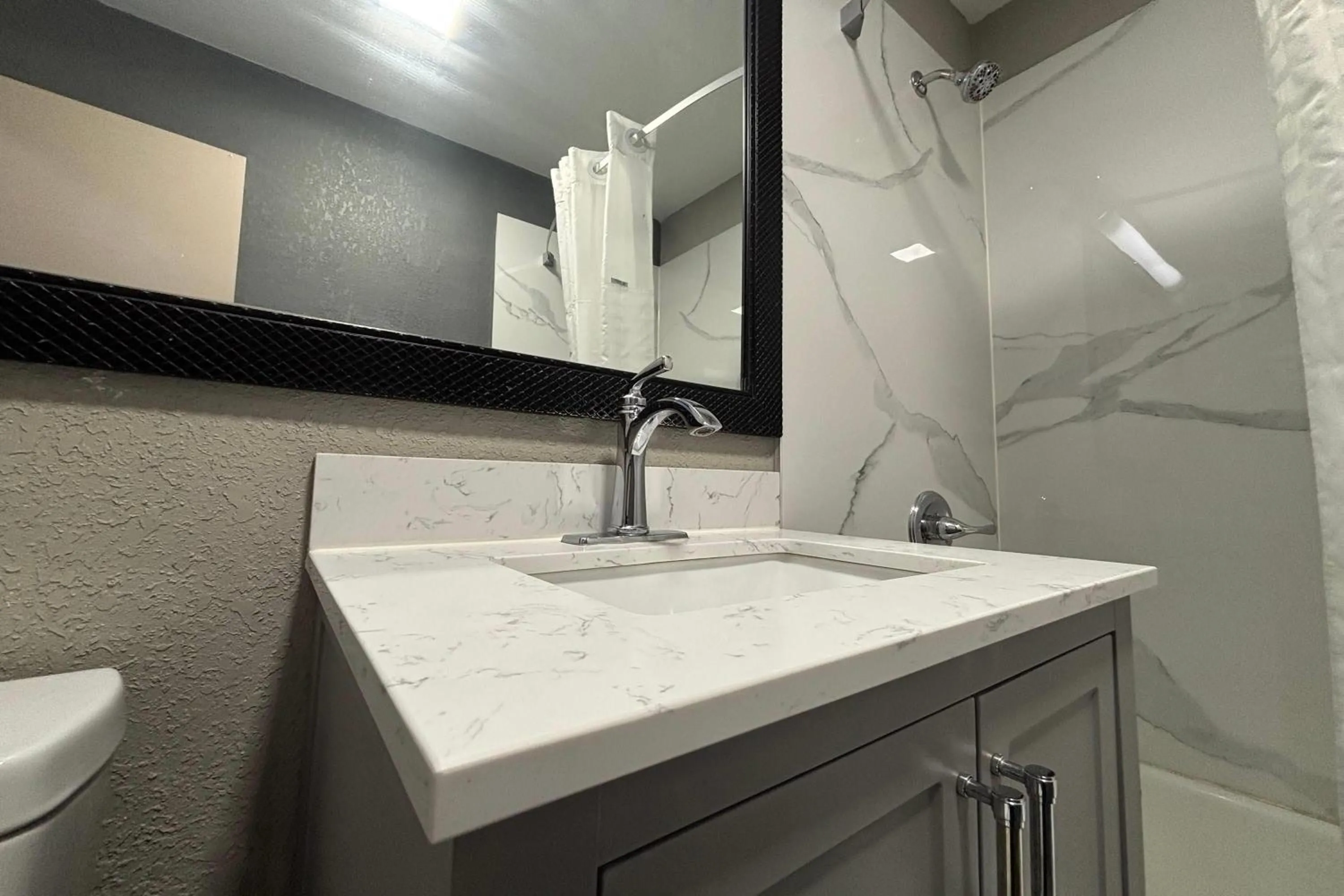 Bathroom in Super 8 by Wyndham Belleville St. Louis Area