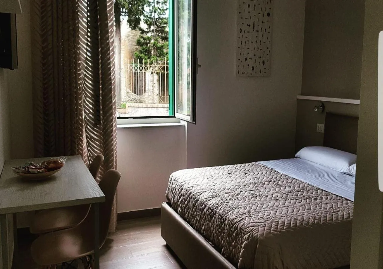 Bed in DIMORA FLEGREA room & breakfast