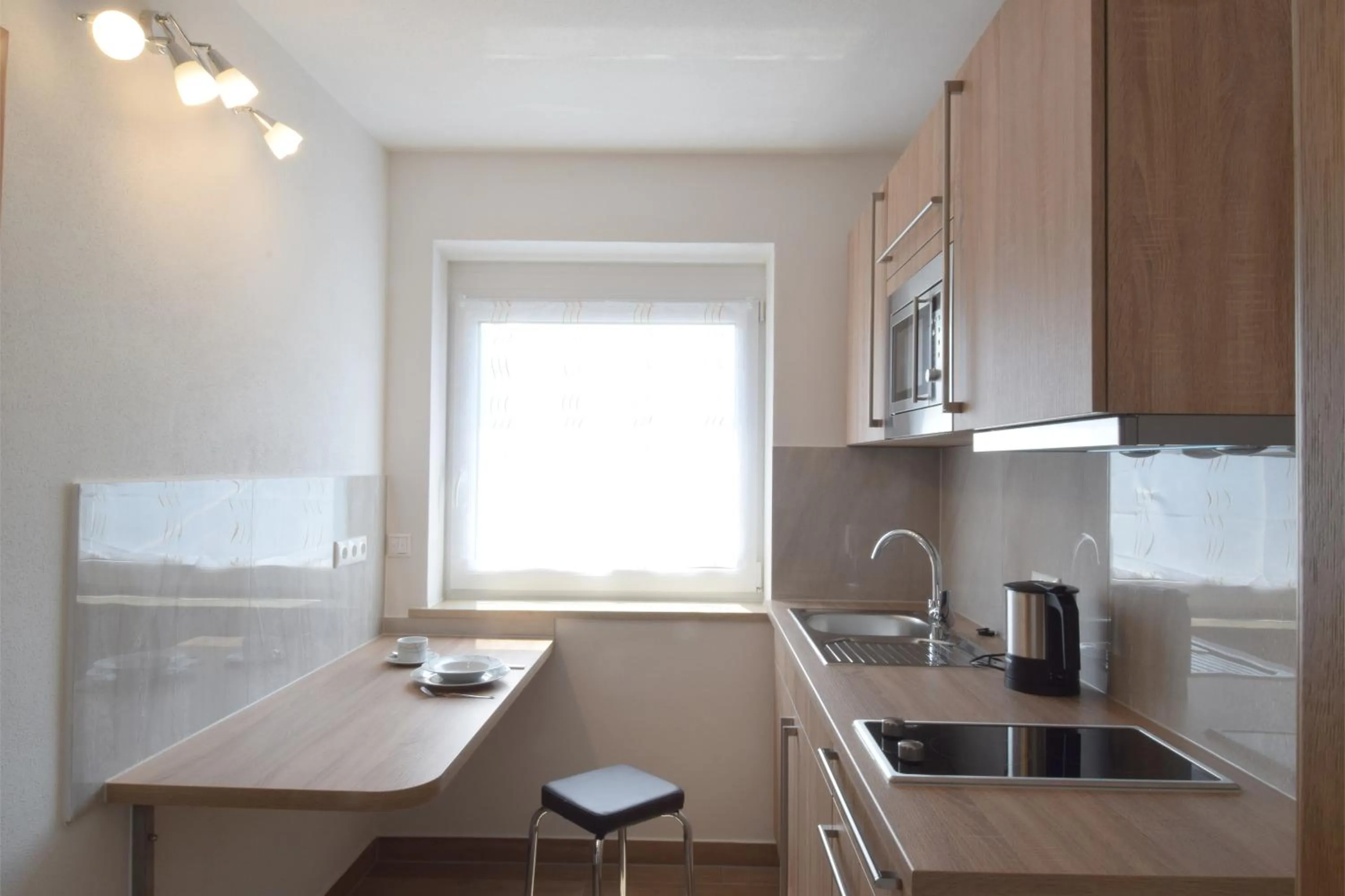 Kitchen or kitchenette in Aparthotel Donaustern